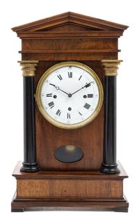A German Walnut and Parcel Ebonized Bracket Clock Height 19 3/4 inches.