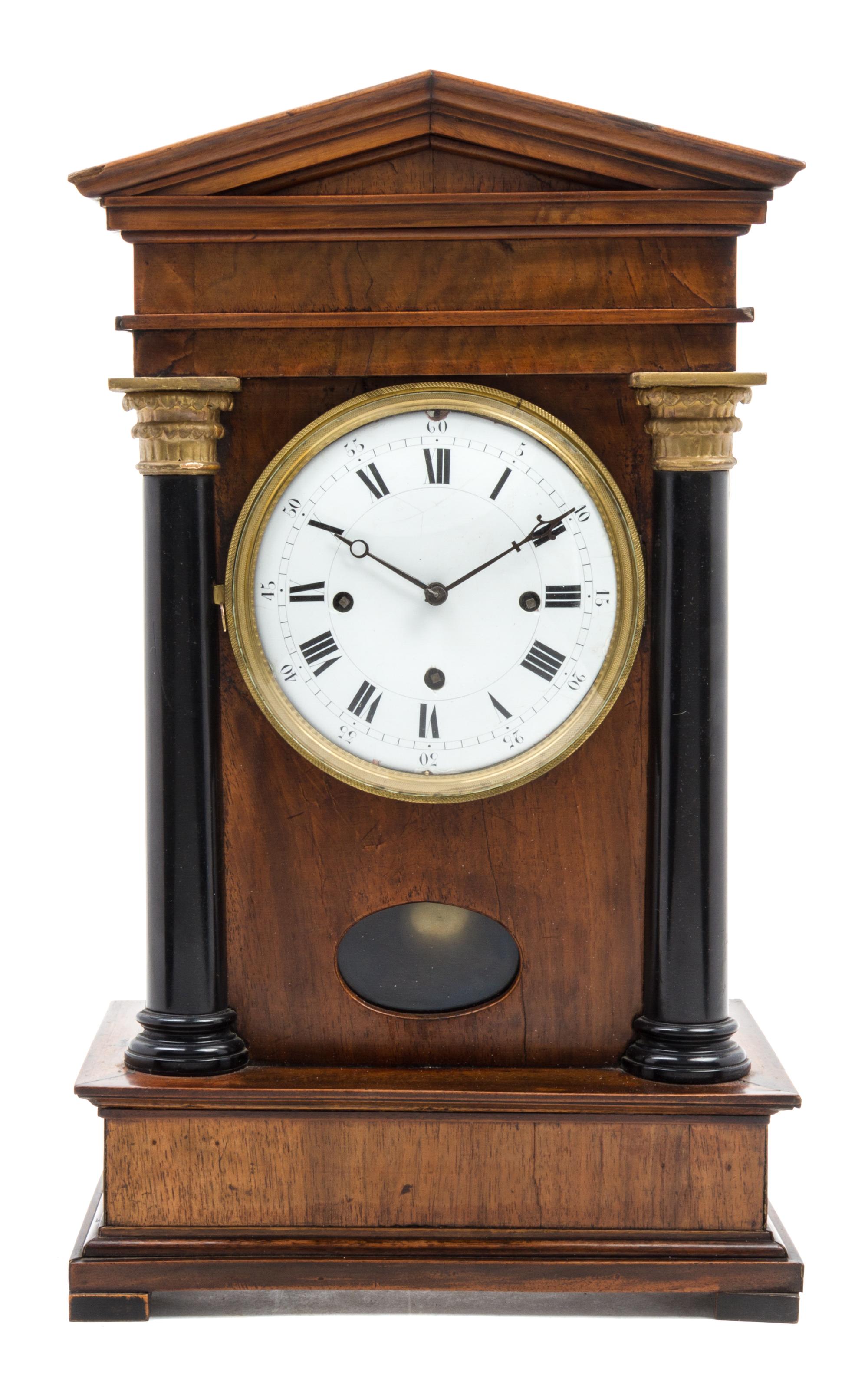 A German Walnut and Parcel Ebonized Bracket Clock Height 19 3/4 inches.
