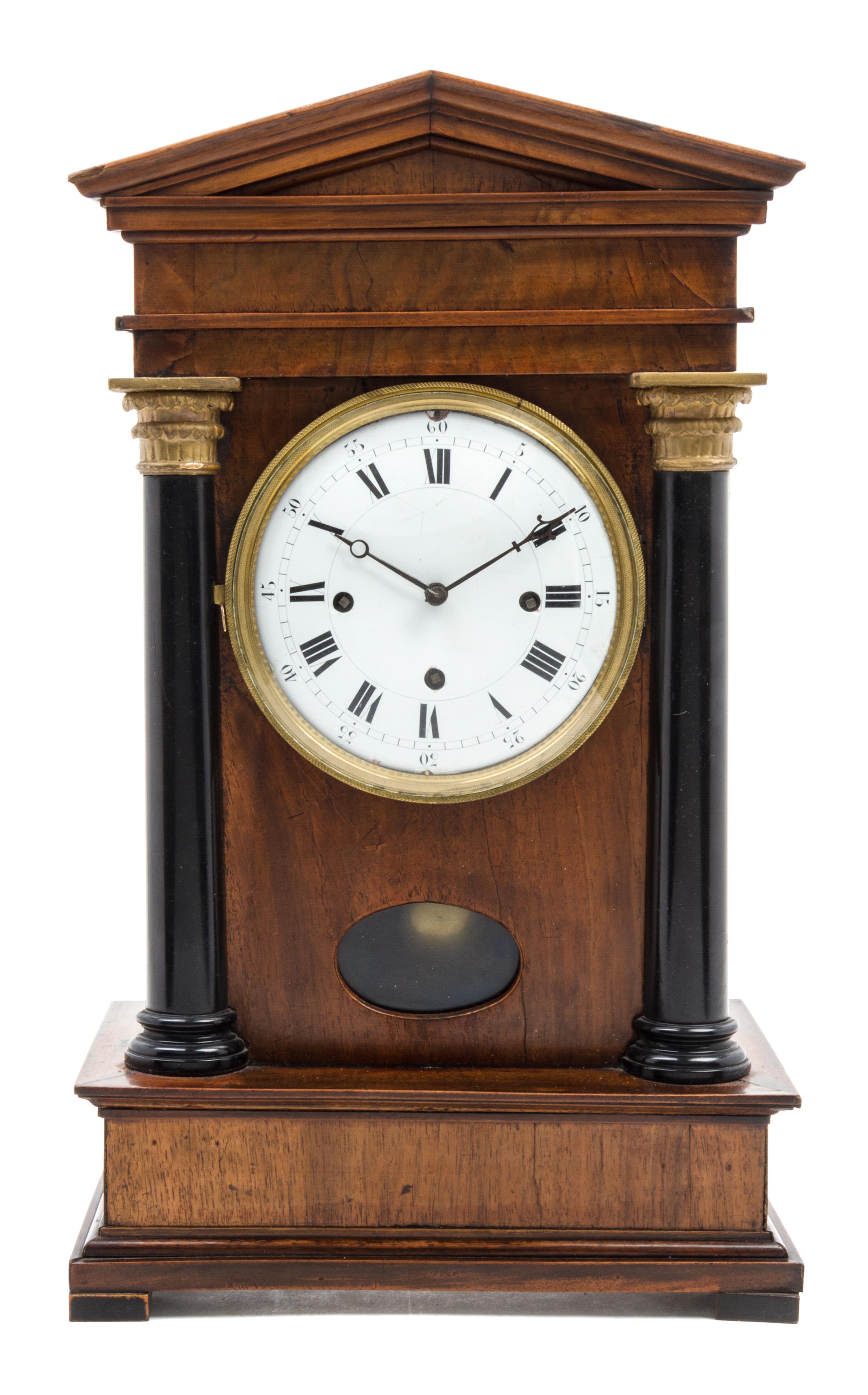 A German Walnut and Parcel Ebonized Bracket Clock Height 19 3/4 inches.