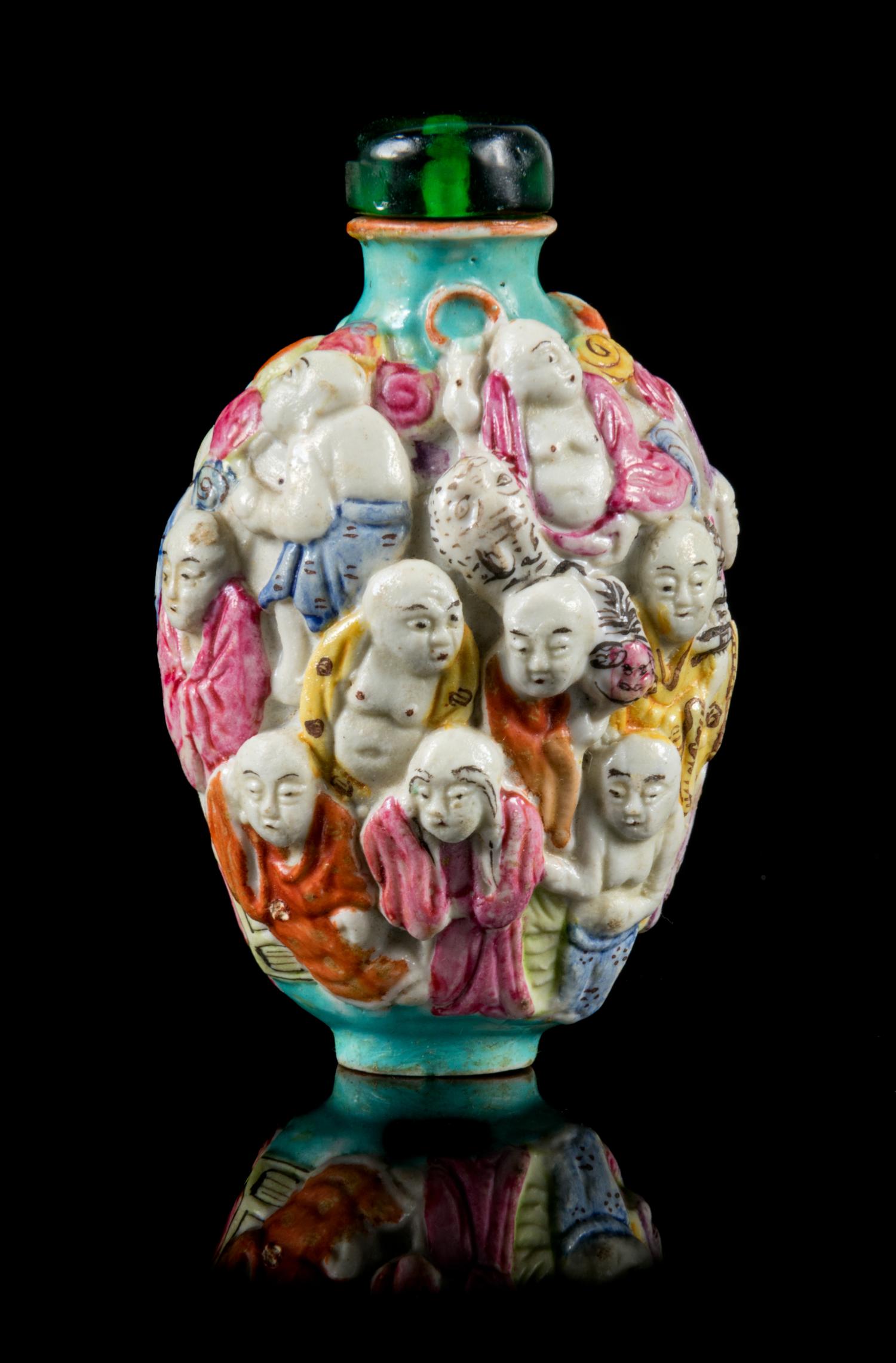 A Molded Famille Rose Porcelain Snuff Bottle Height 3 1/8 inches. — 19TH CENTURY