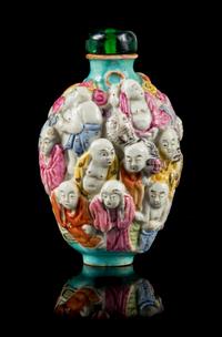 A Molded Famille Rose Porcelain Snuff Bottle Height 3 1/8 inches. — 19TH CENTURY