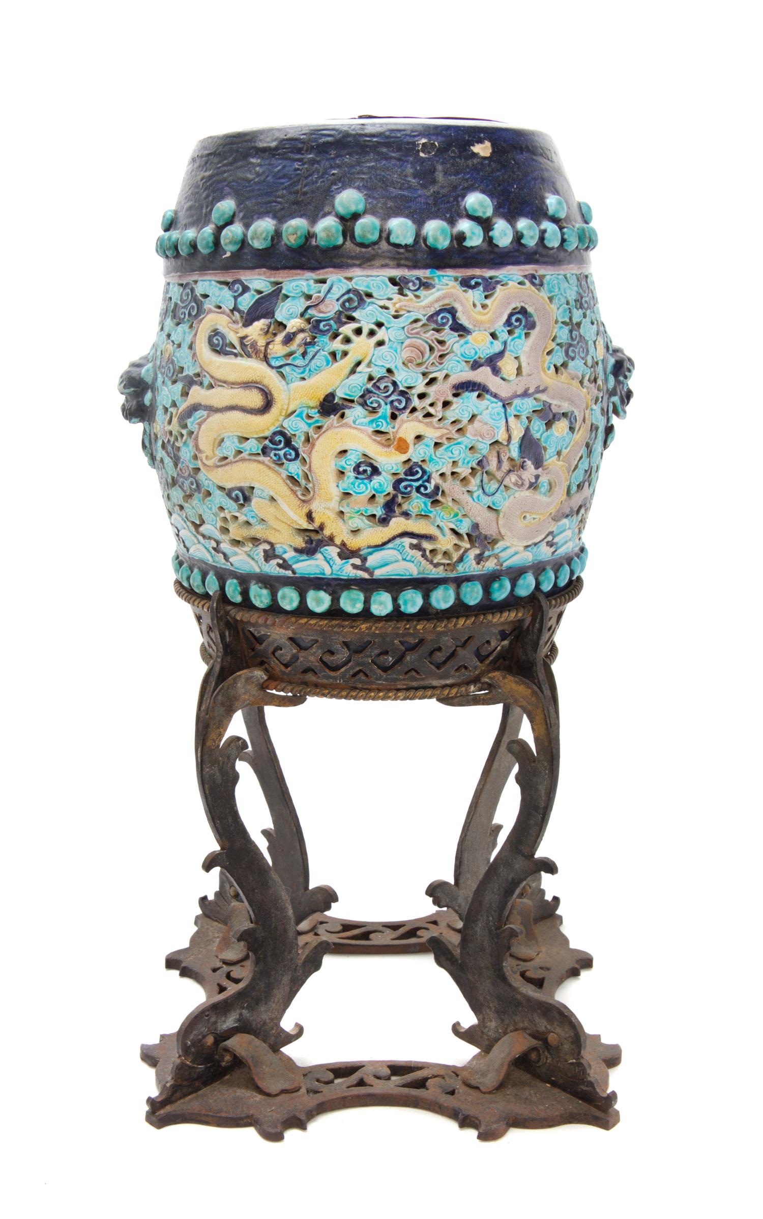 A Chinese Fahua Porcelain Stool, Gudeng Height 14 3/8 inches; with stand overall 26 3/8 inches. — MING DYNASTY (1368-1644)