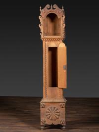 A Folk Art Carved Maple Clock Case