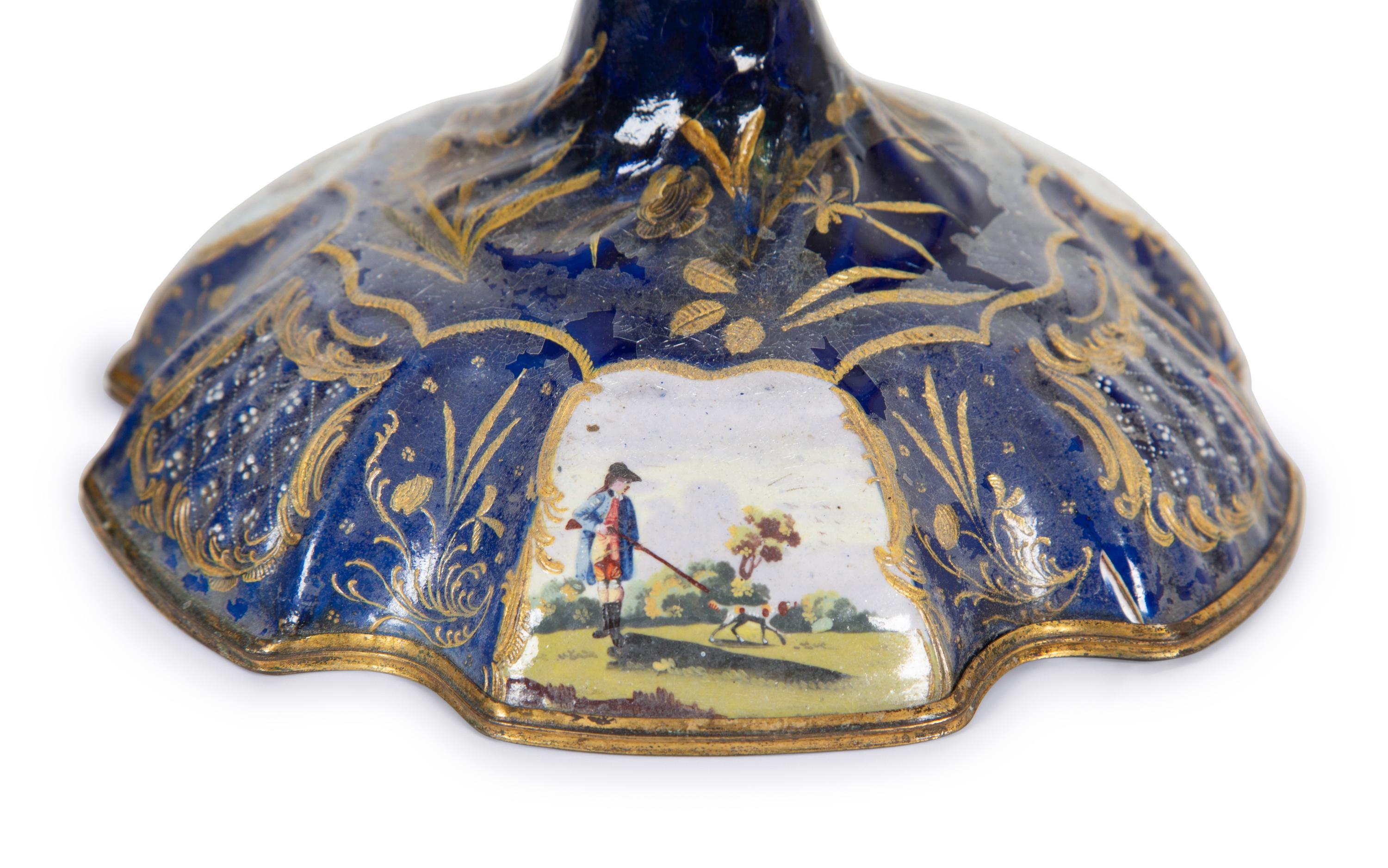 A Pair of Battersea Enamel Candlesticks