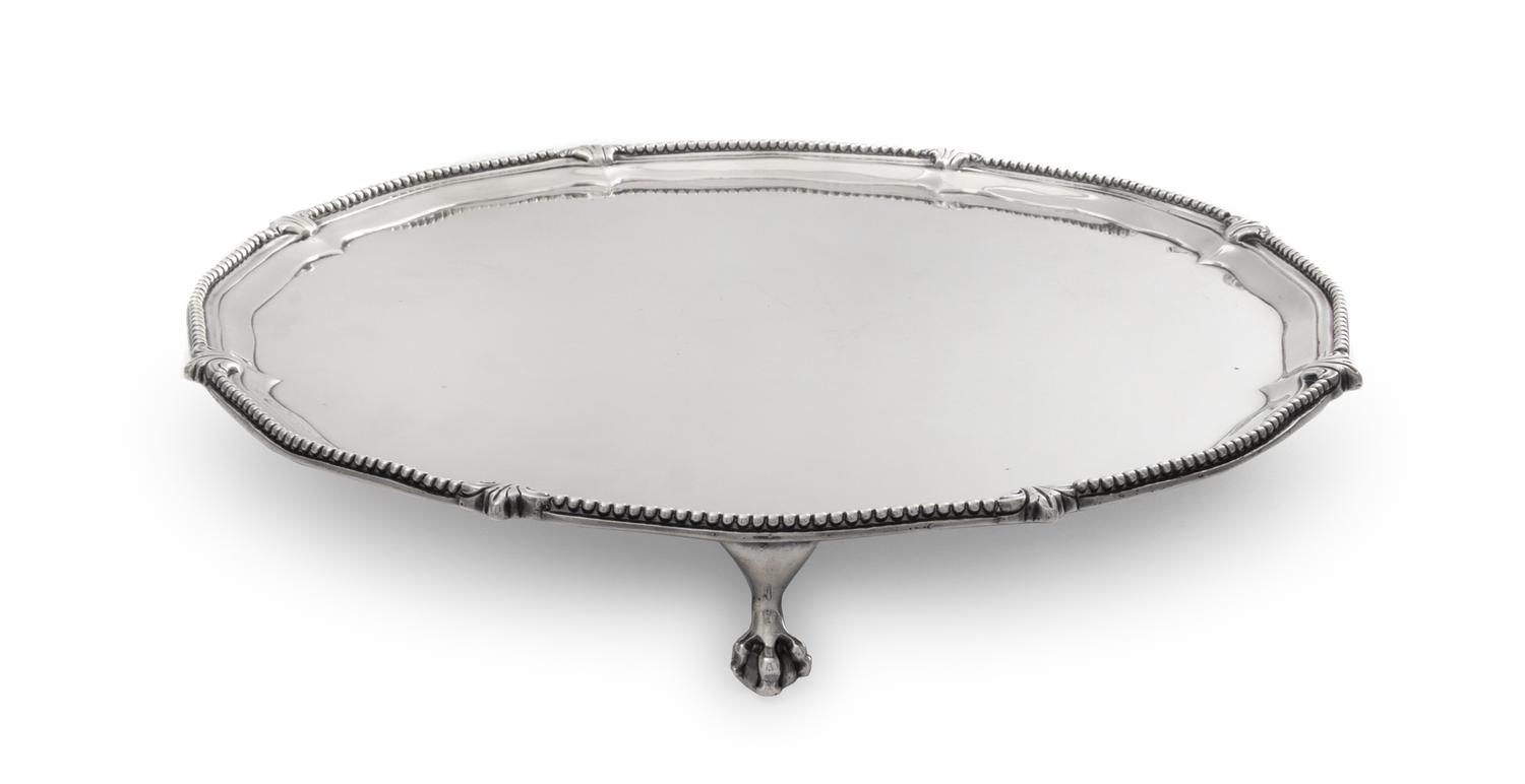 An English Silver Salver, Robert Jones I, London, 1774, raised on paw feet.