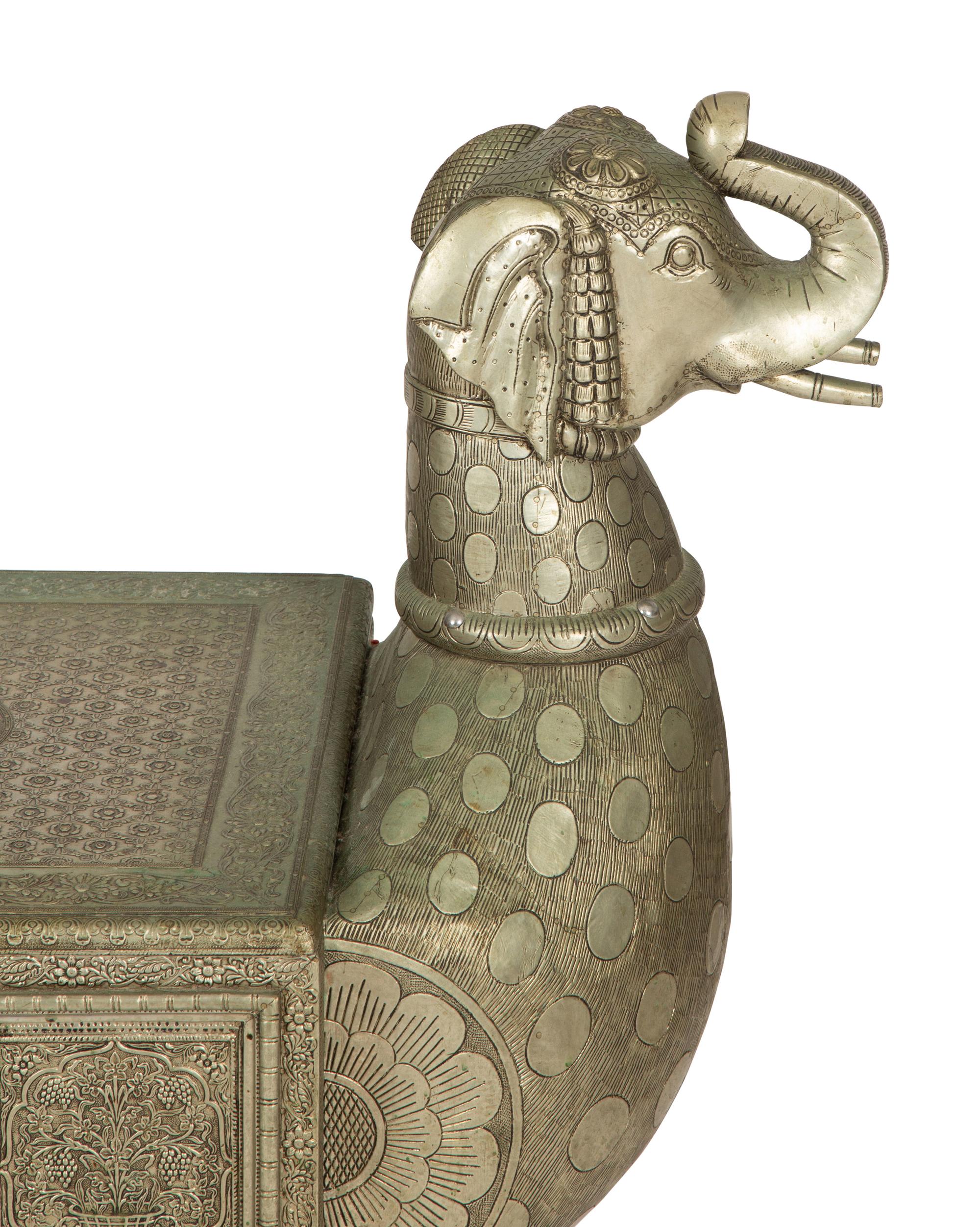 A South-East Asian Pressed Metal Bench with Elephant Form Ends — 20th Century