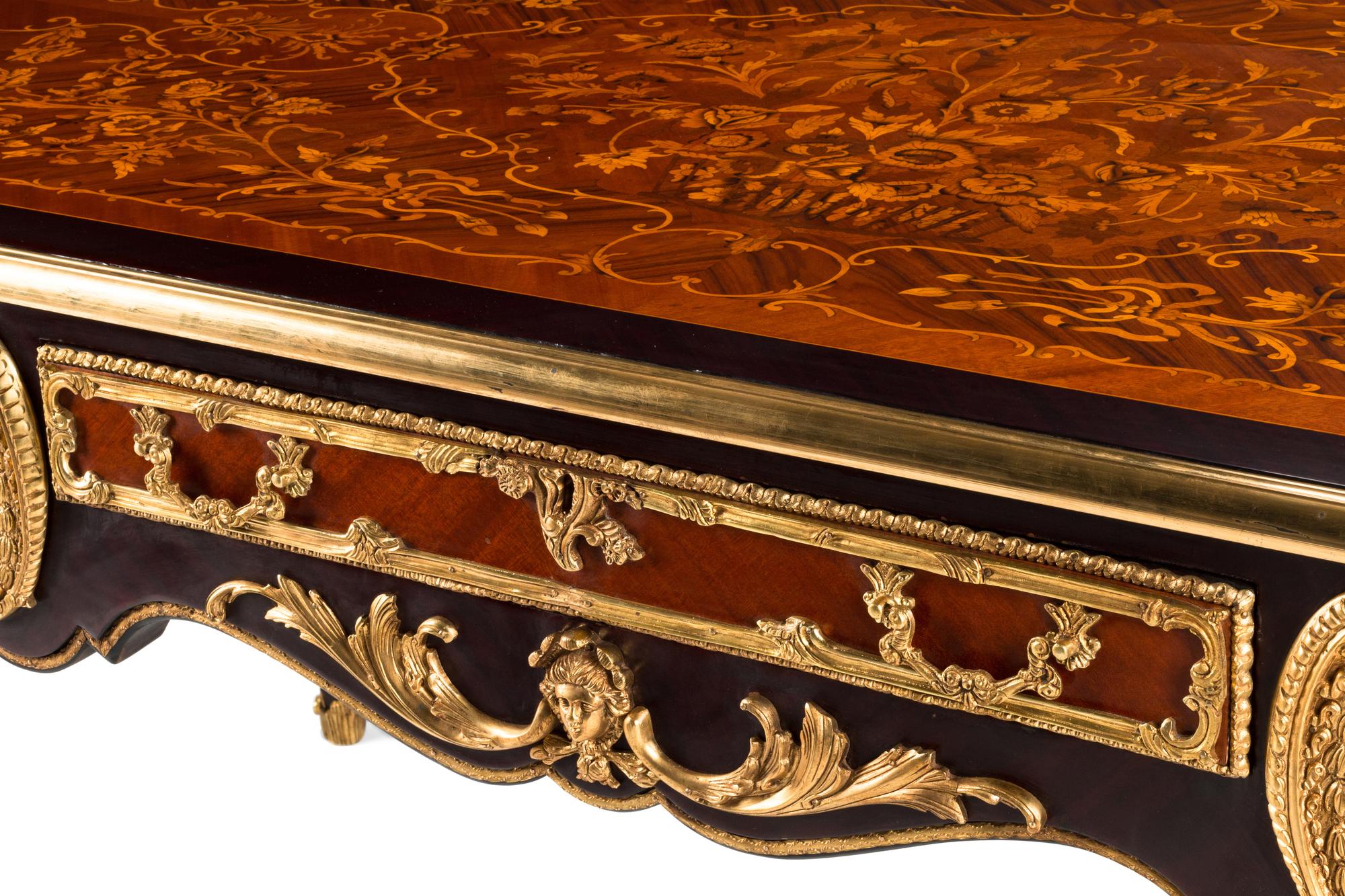 A Louis XV Style Gilt Bronze Mounted Marquetry Bureau Plat
