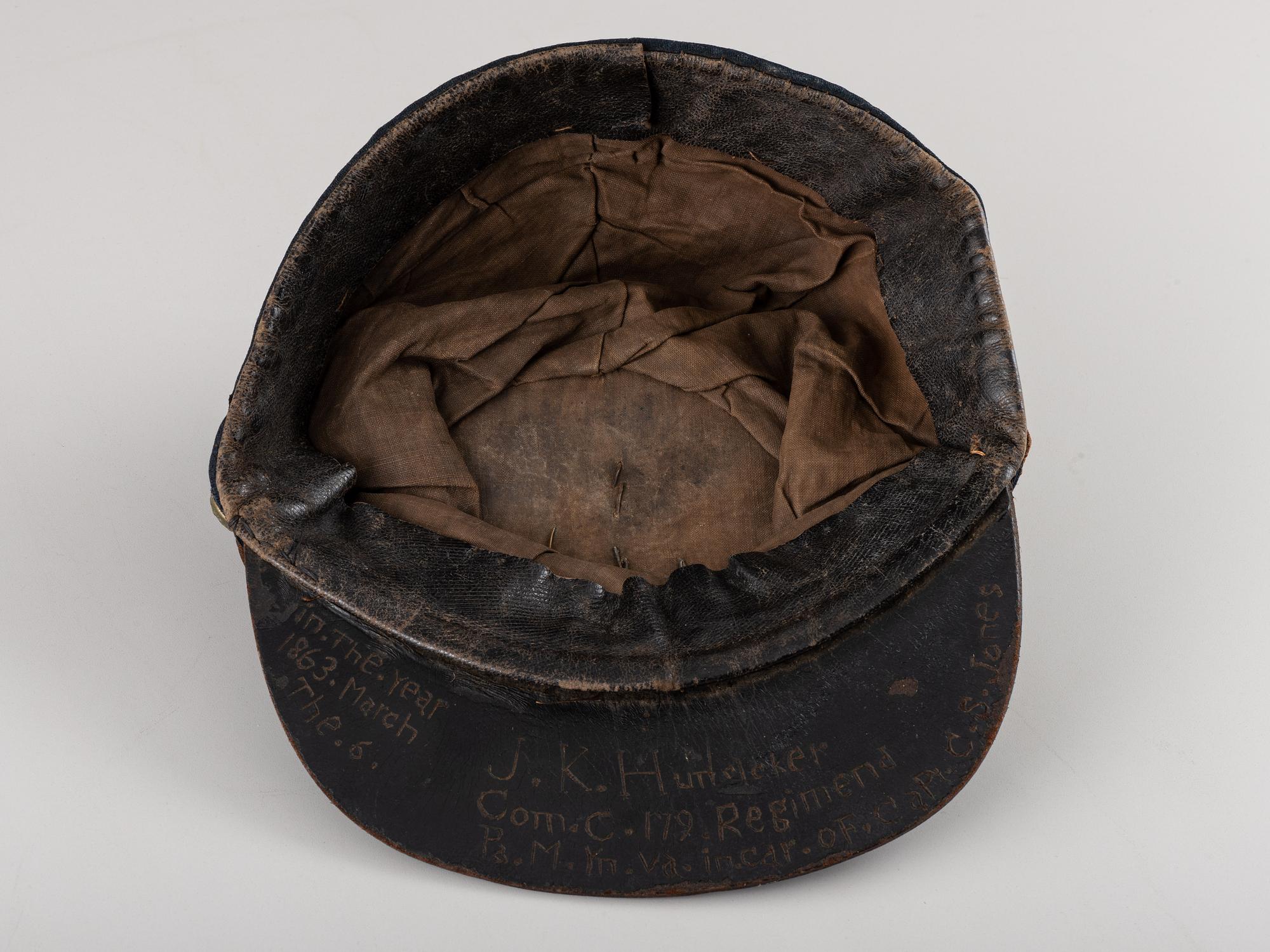 [CIVIL WAR]. Company C, 179th Pennsylvania 1858 forage cap, with identification to J.K. Hunsleker carved into visor.