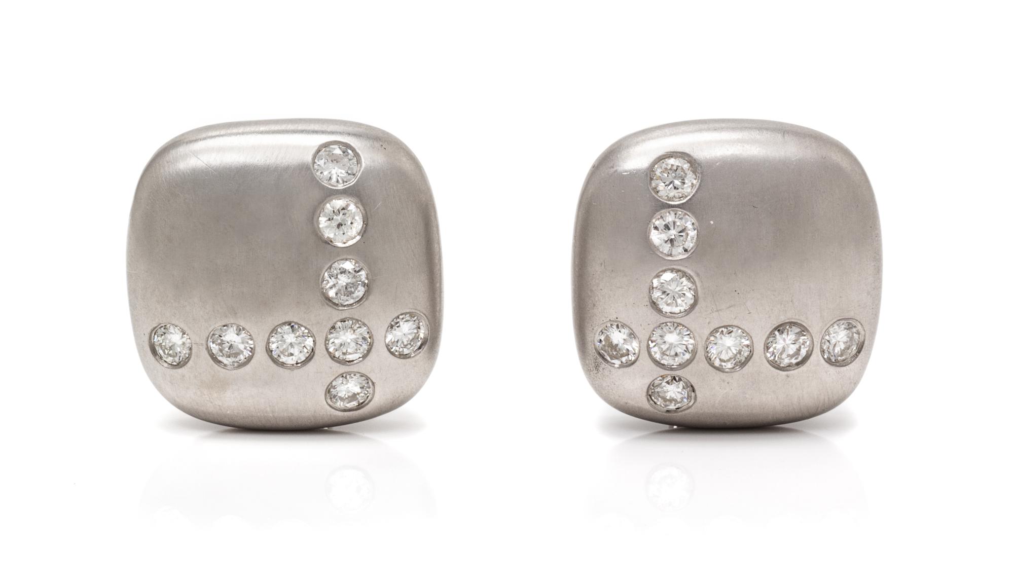 A Pair of 18 Karat White Gold and Diamond Earclips, Carvin French, 17.50 dwts.