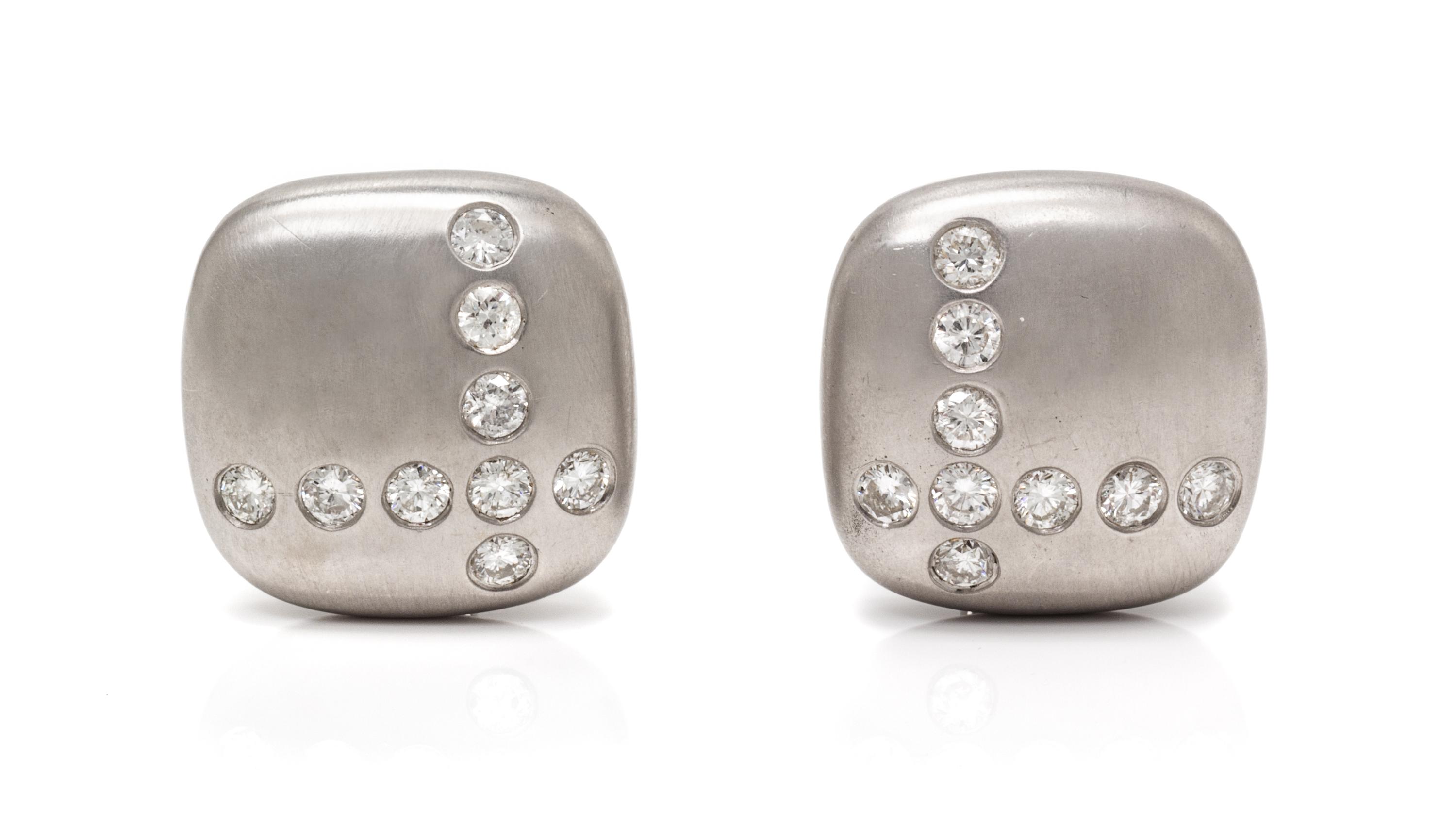 A Pair of 18 Karat White Gold and Diamond Earclips, Carvin French, 17.50 dwts.