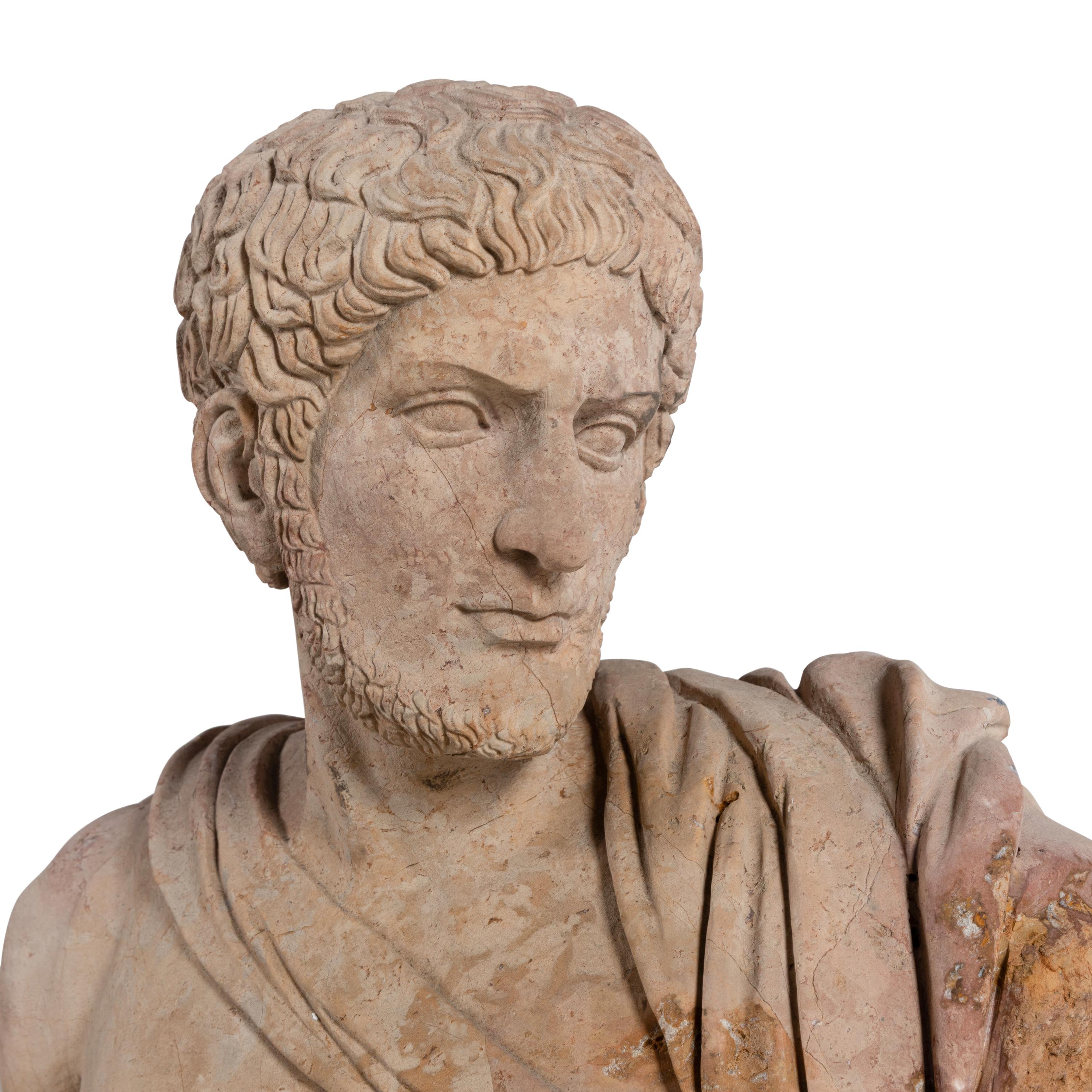 A Roman Style Carved Stone Torso of a Man