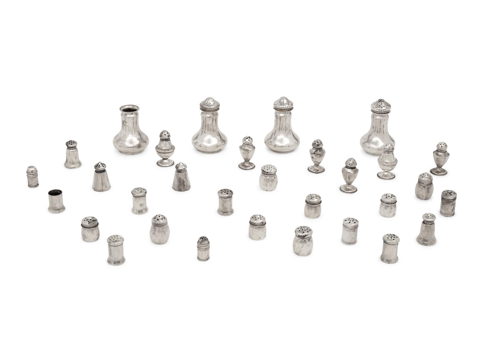 A Large Collection of Silver Casters