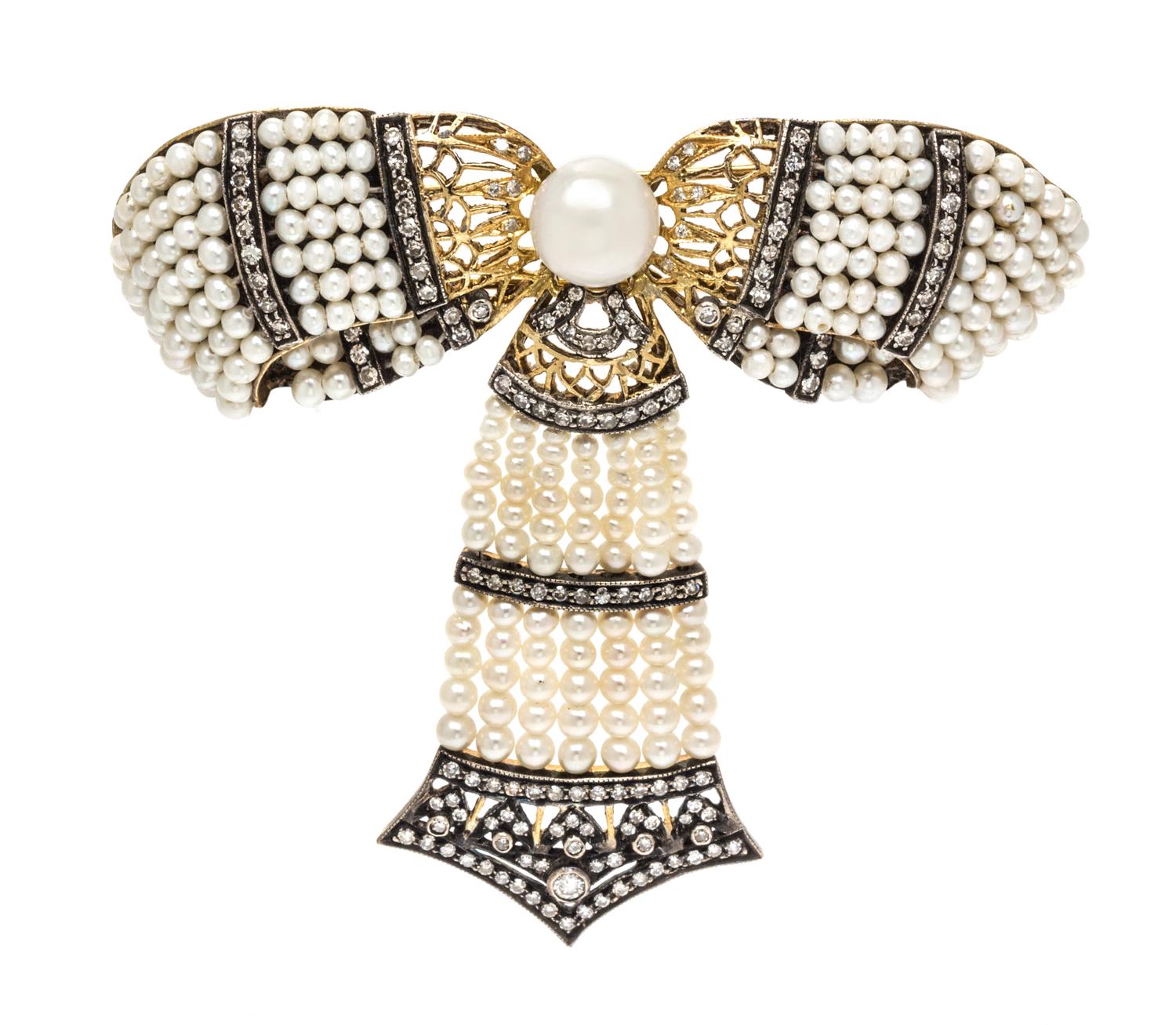 A Silver Topped Gold, Cultured Pearl, Seed Pearl and Diamond Bow Brooch, 18.50 dwts.