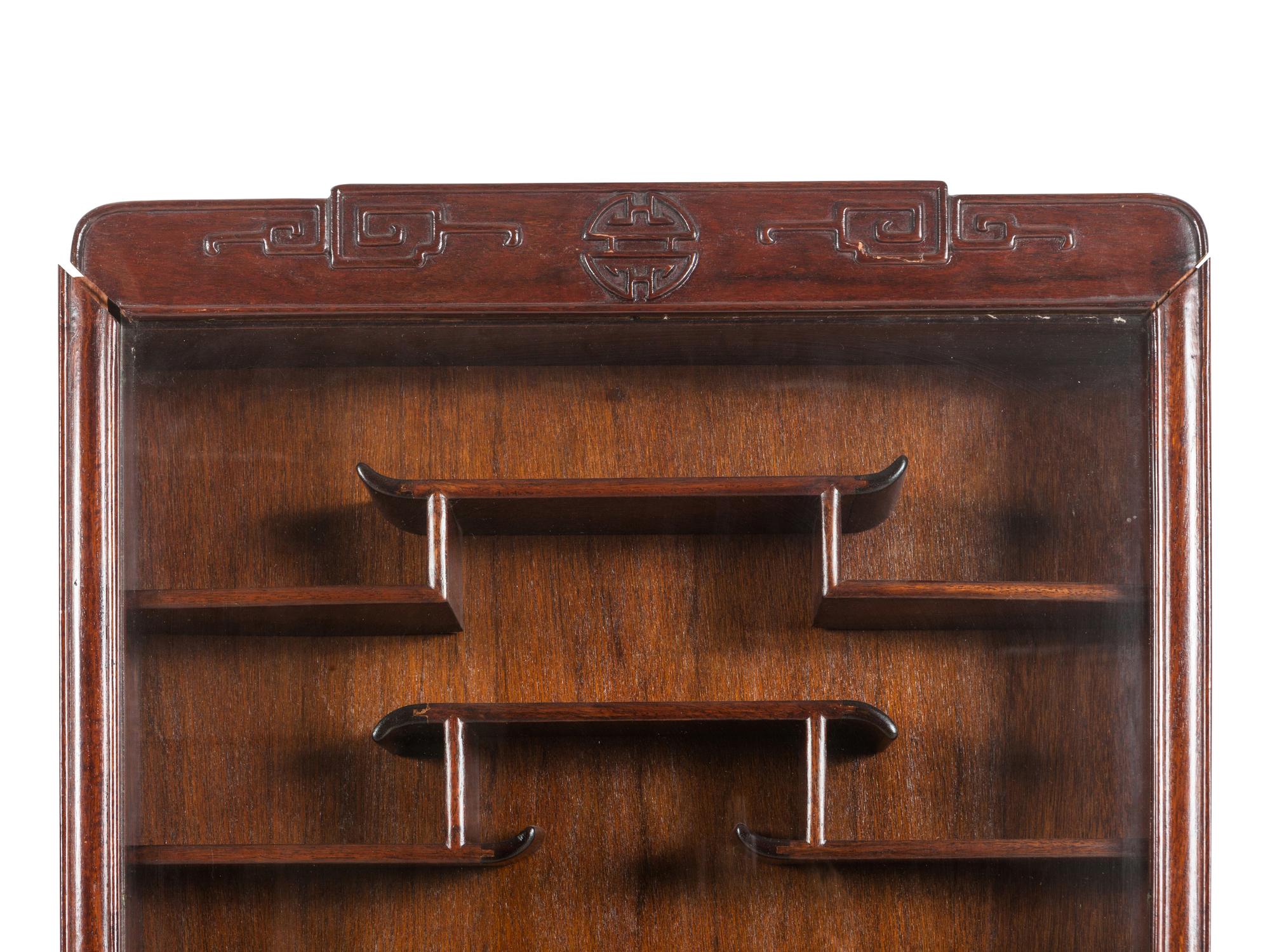 A Pair of Chinese Carved Hardwood Vitrine Cabinets