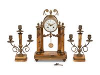 A French Gilt Metal and Siena Marble Three-Piece Clock Garniture