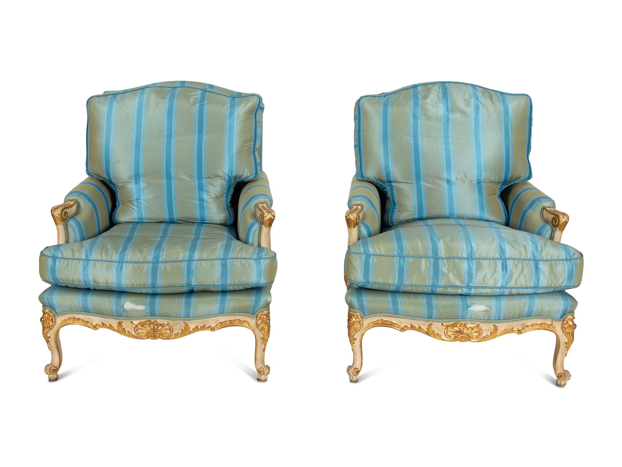 A Pair of Louis XV Style Painted and Parcel Gilt Bergeres