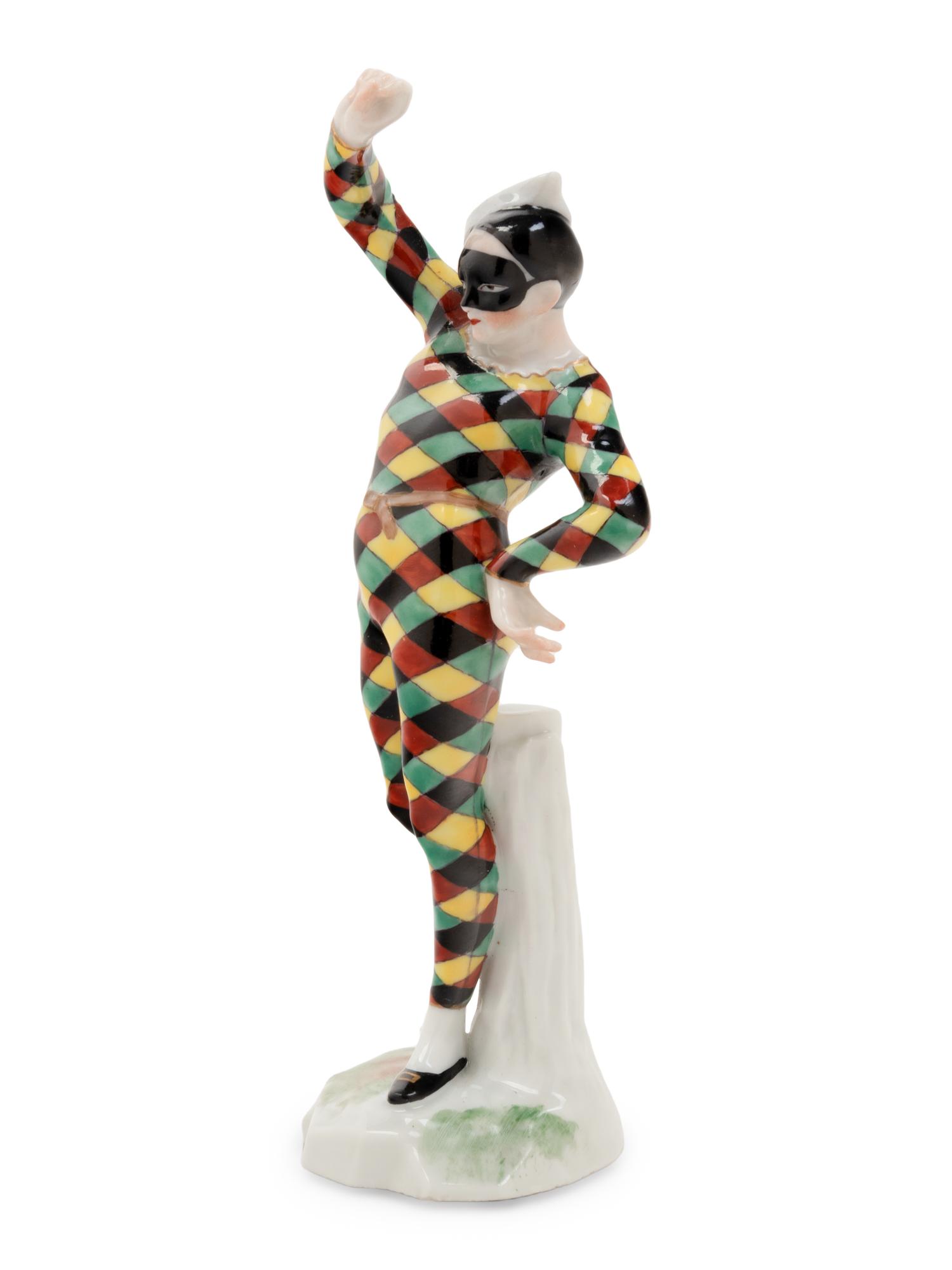 A German Porcelain Harlequin Figure