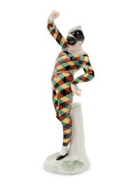A German Porcelain Harlequin Figure