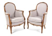 A Pair of Louis XV Style Walnut Bergeres, Height 34 inches.