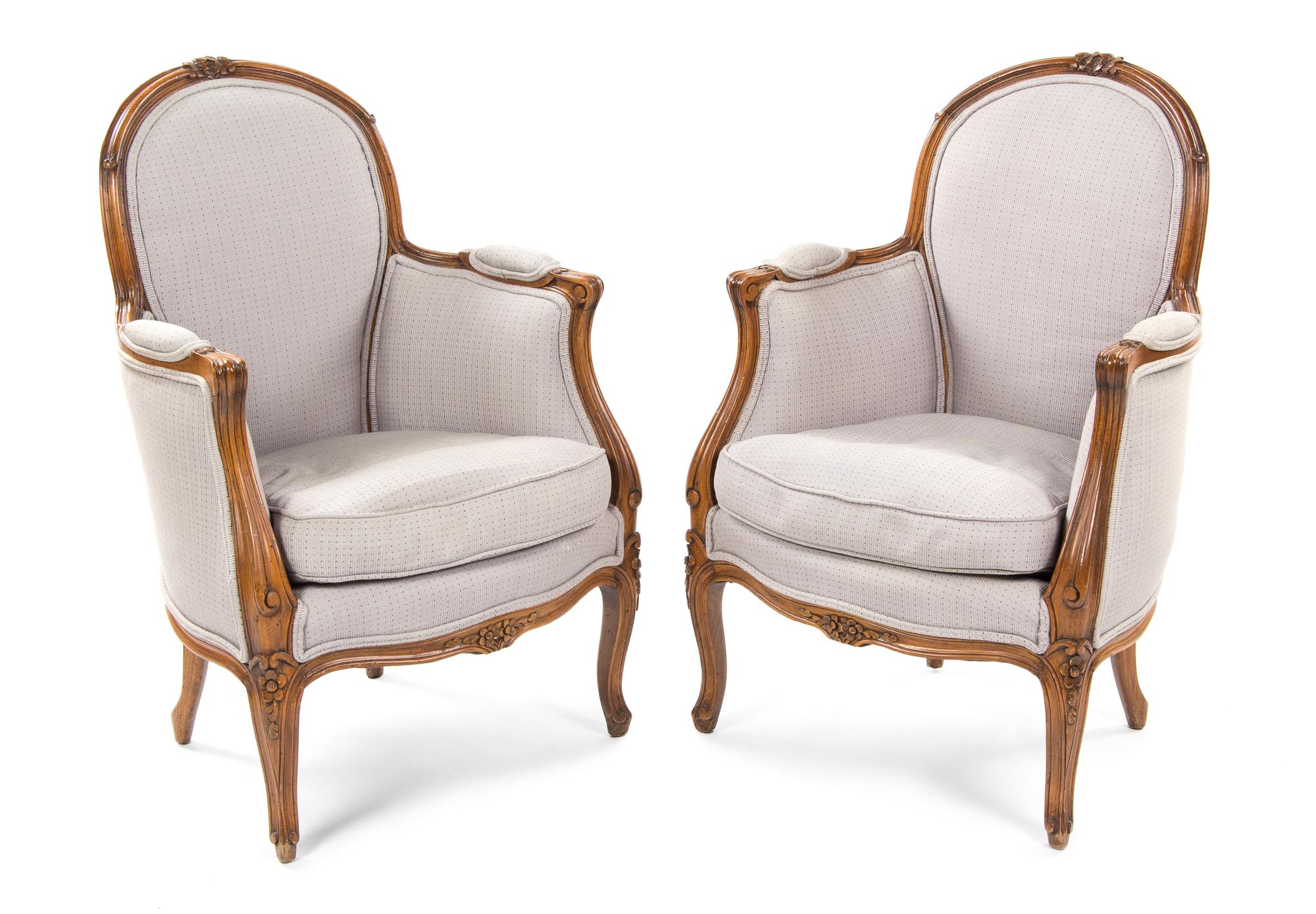 A Pair of Louis XV Style Walnut Bergeres, Height 34 inches.