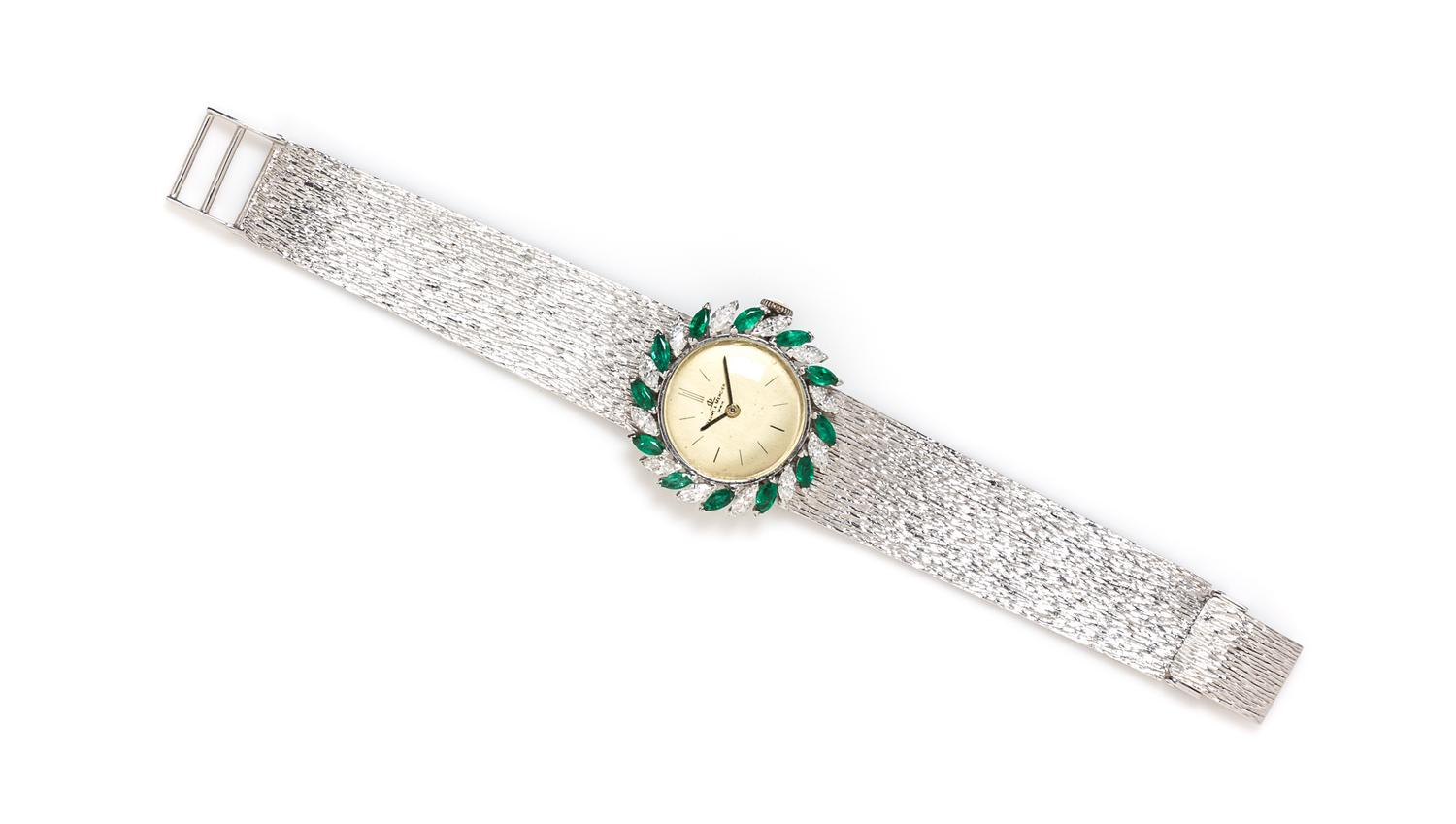 An 18 Karat White Gold, Diamond and Emerald Wristwatch, Baume & Mercier, 34.70 dwts.