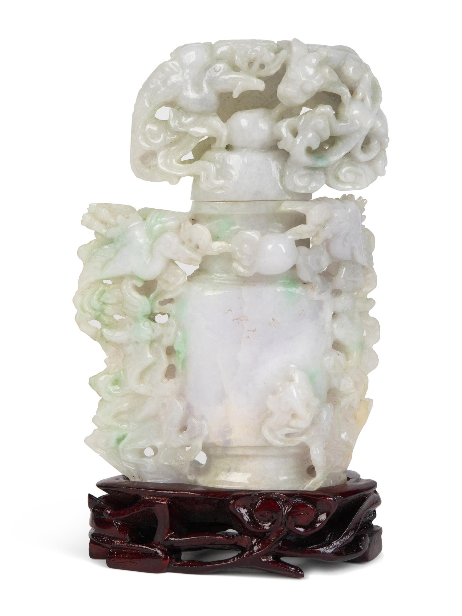 A Chinese Carved Jadeite Urn with Flowers