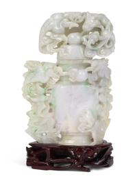 A Chinese Carved Jadeite Urn with Flowers