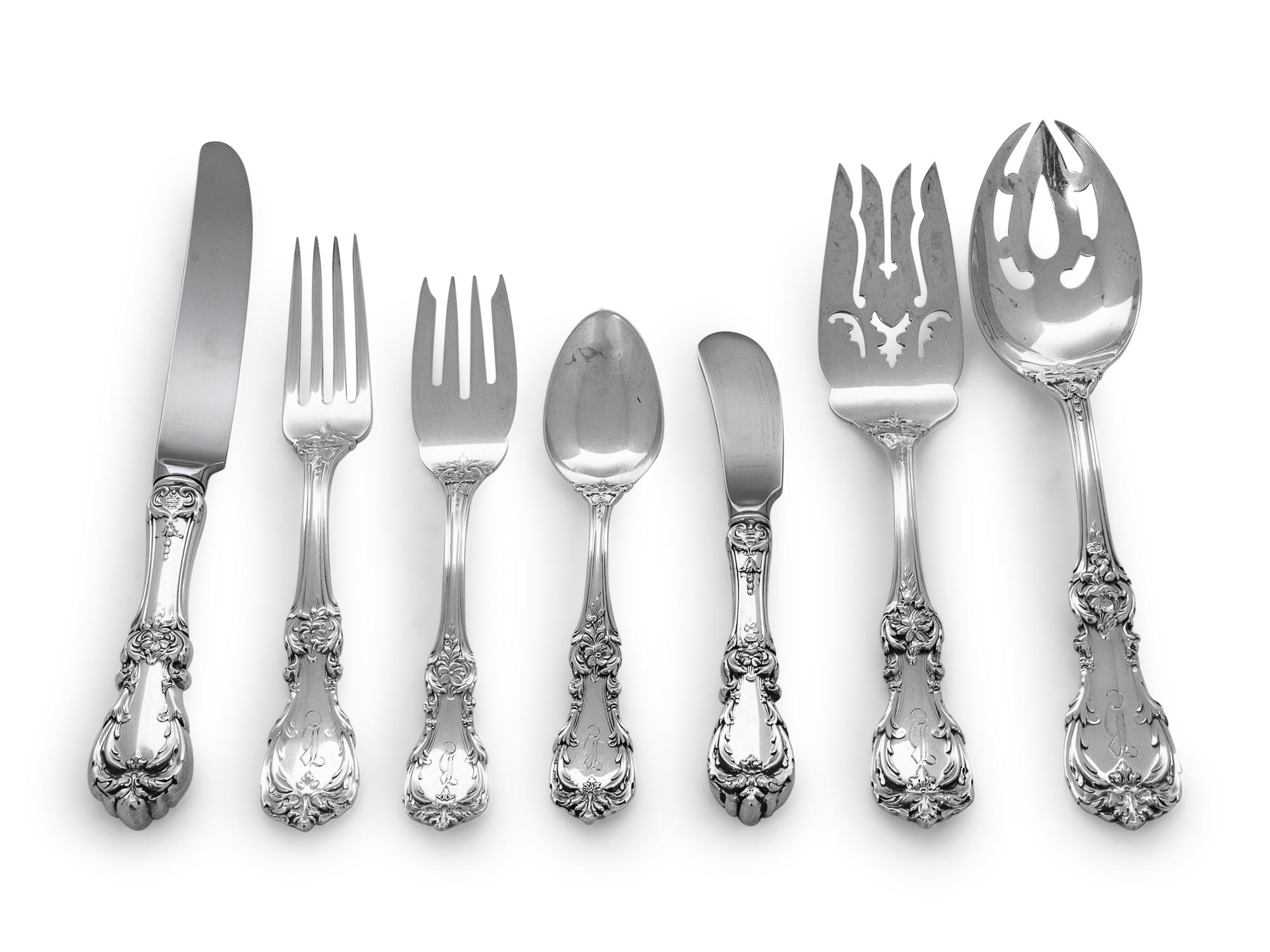Burgundy pattern, comprising: 14 dinner knives with stainless steel blades 14 butter spreaders with stainless steel blades 14 dinner forks 24 teaspoons 14 iced teaspoons 14 salad forks 4 serving spoons 2 serving forks 7 various serving articles 107 items total.