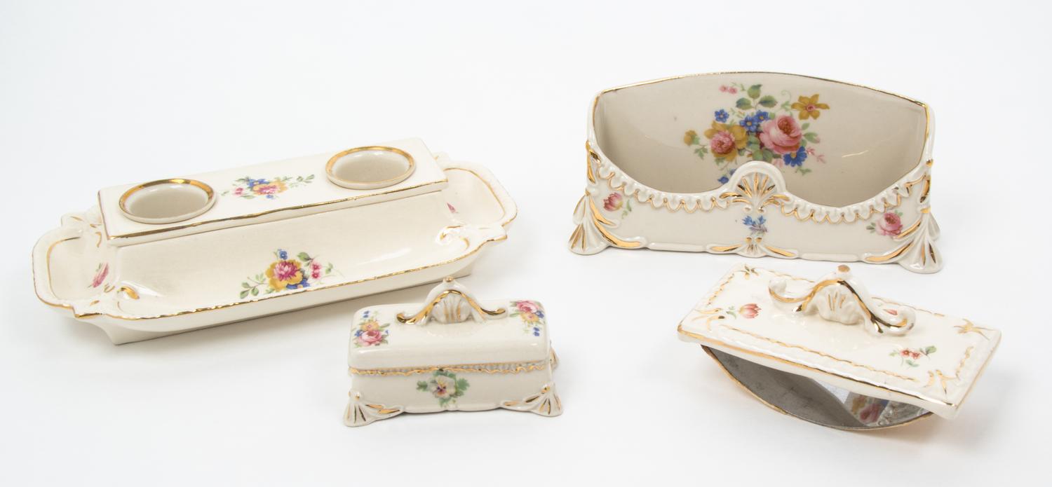 A Parcel Gilt Porcelain Desk Set Width of largest 10 1/4 inches.