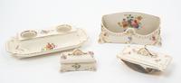 A Parcel Gilt Porcelain Desk Set Width of largest 10 1/4 inches.