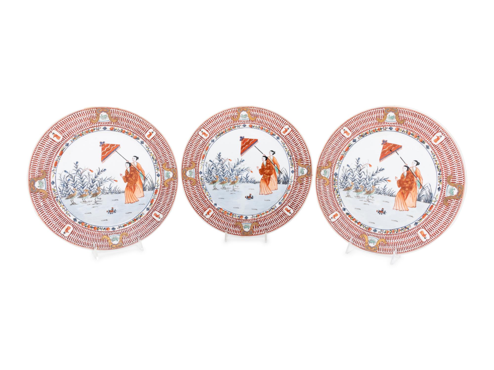 A Set of Eight "Pronk Dame au Parasol" Porcelain Chargers