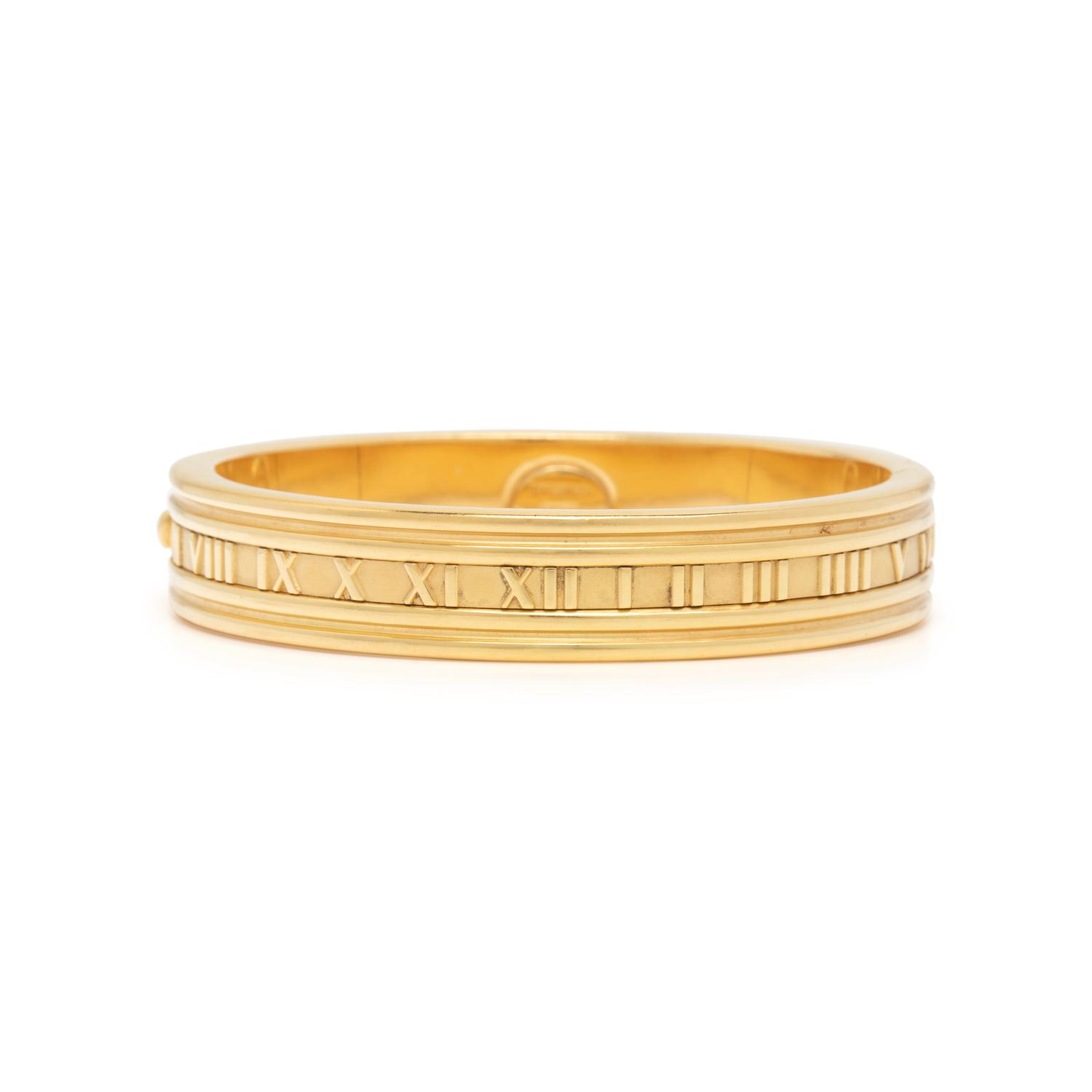 TIFFANY & CO., YELLOW GOLD 'ATLAS' BANGLE BRACELET