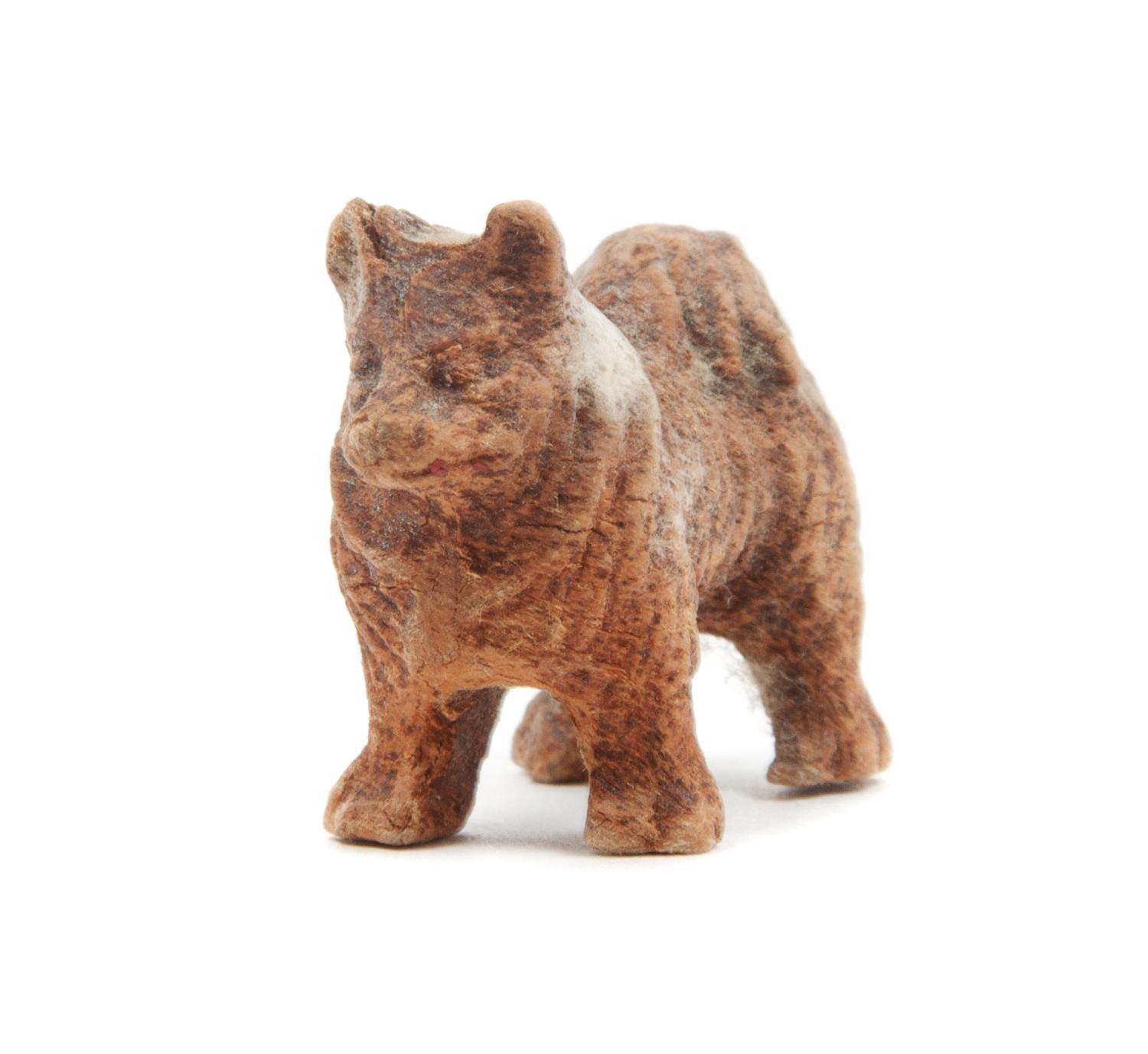 A Small Wooden Pomeranian Figure Width 1 inch.