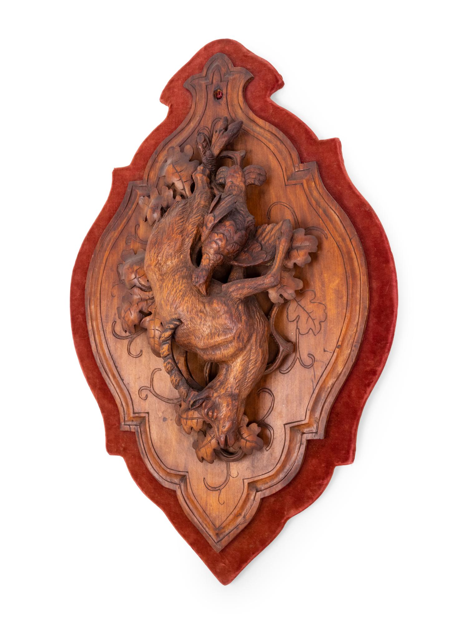 A Black Forest Carved Game Plaque