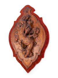 A Black Forest Carved Game Plaque