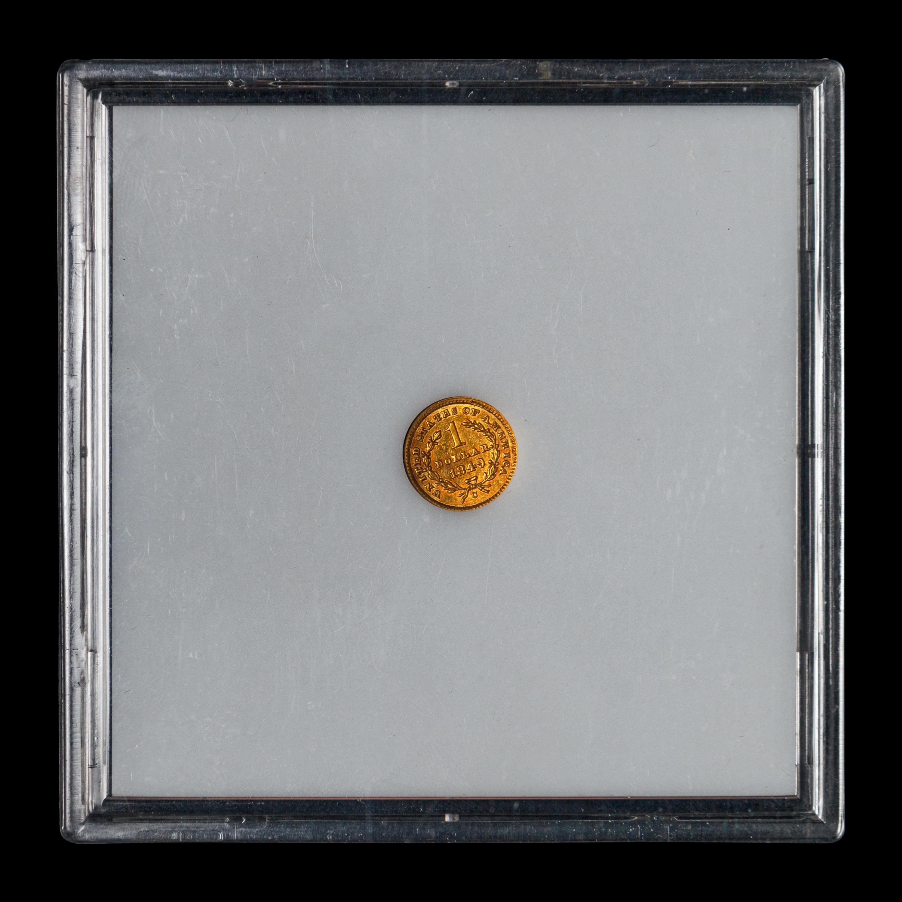 An 1849-C Liberty Head: Closed Wreath $1 Gold Coin