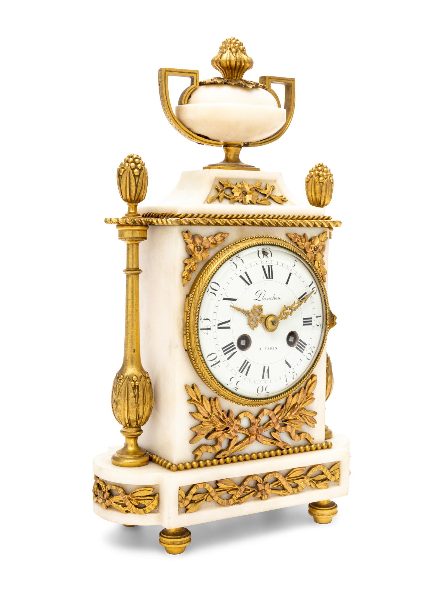 A French Gilt Bronze and Marble Clock
