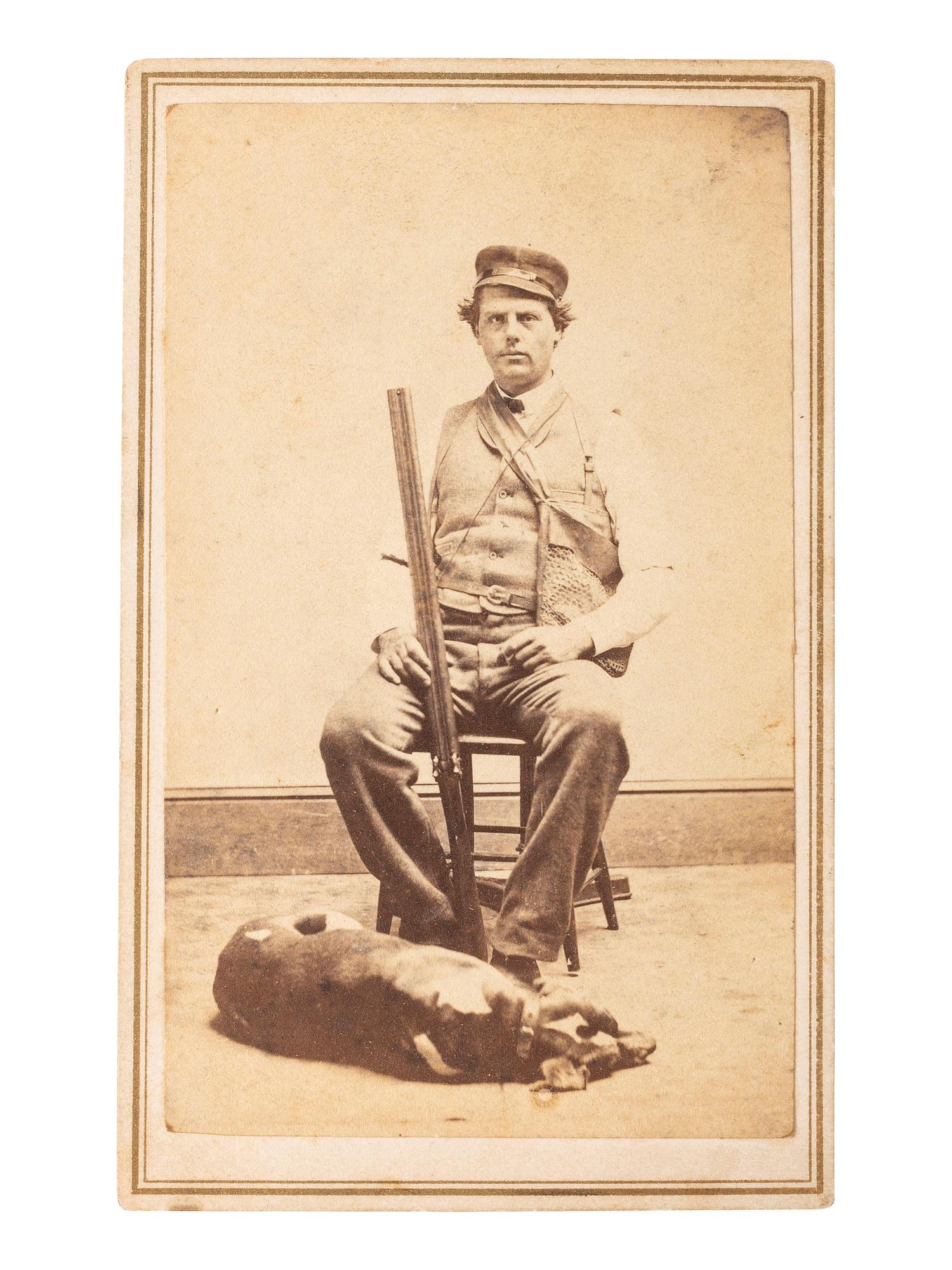 [EARLY PHOTOGRAPHY]. FLINT, B.W., photographer. CDV of armed hunter posed with his dog. New Haven, CT.