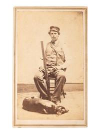 [EARLY PHOTOGRAPHY]. FLINT, B.W., photographer. CDV of armed hunter posed with his dog. New Haven, CT.