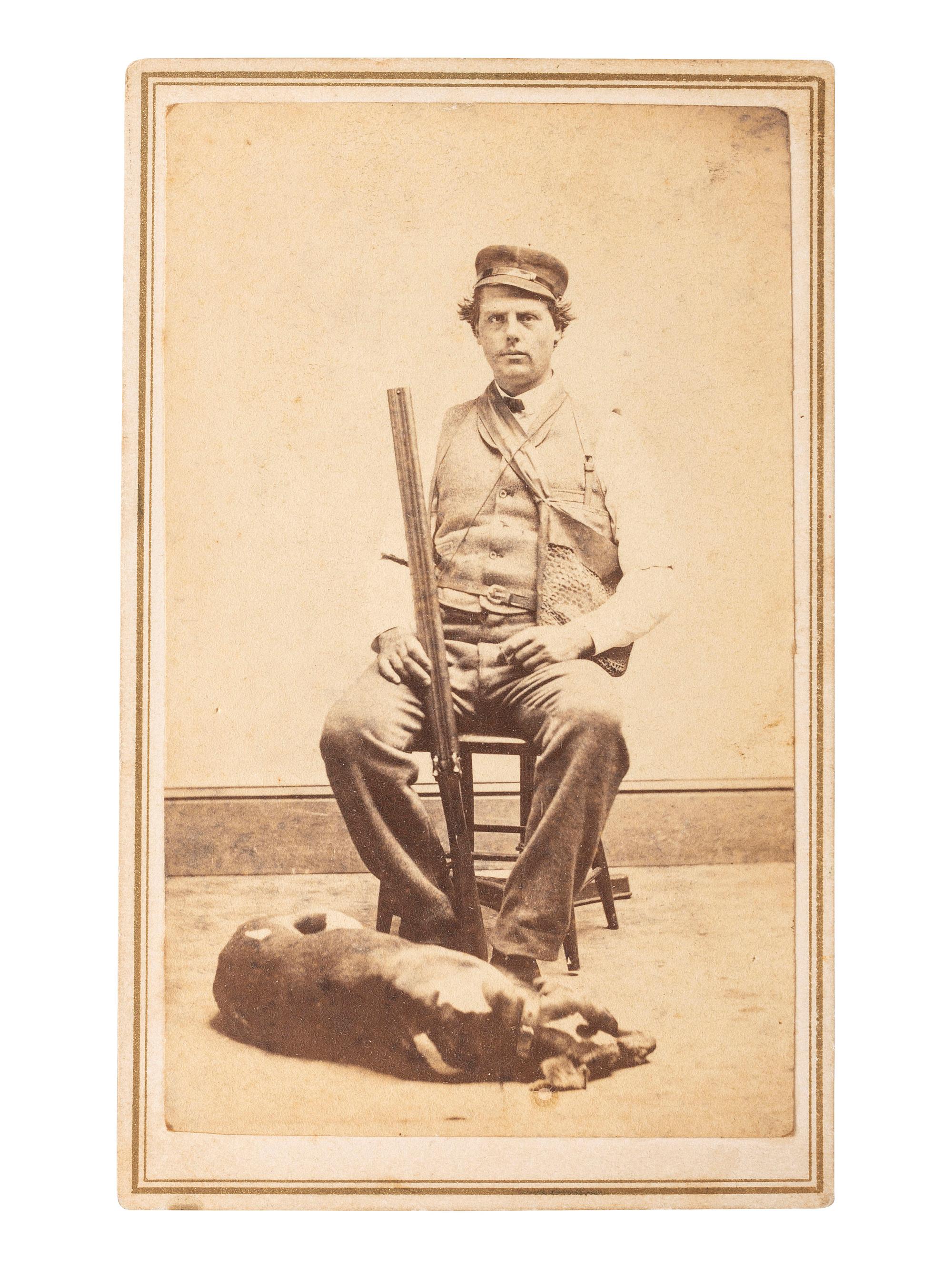 [EARLY PHOTOGRAPHY]. FLINT, B.W., photographer. CDV of armed hunter posed with his dog. New Haven, CT.