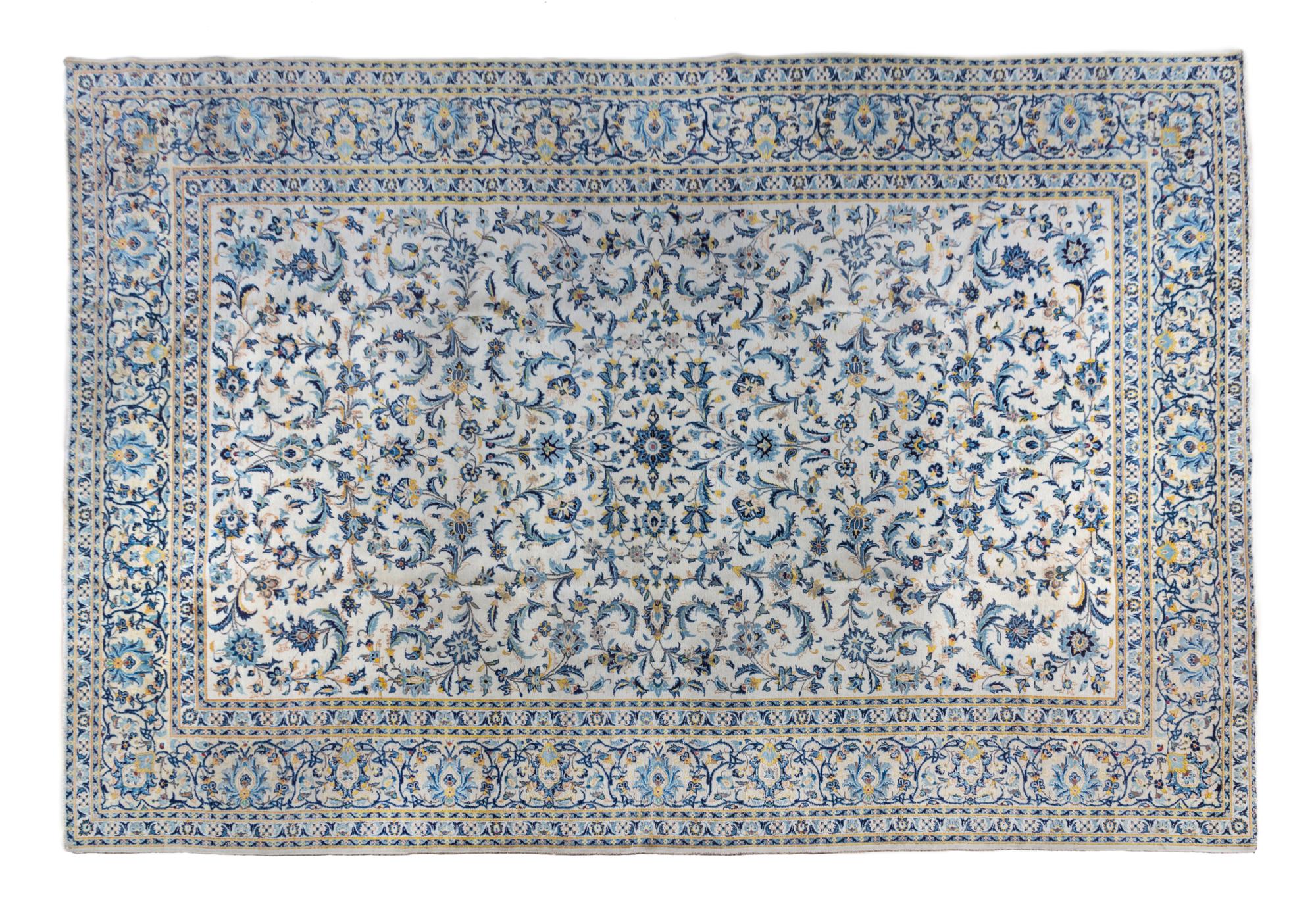 A Kashan Wool Rug 14 feet 10 inches x 10 feet 3 inches.
