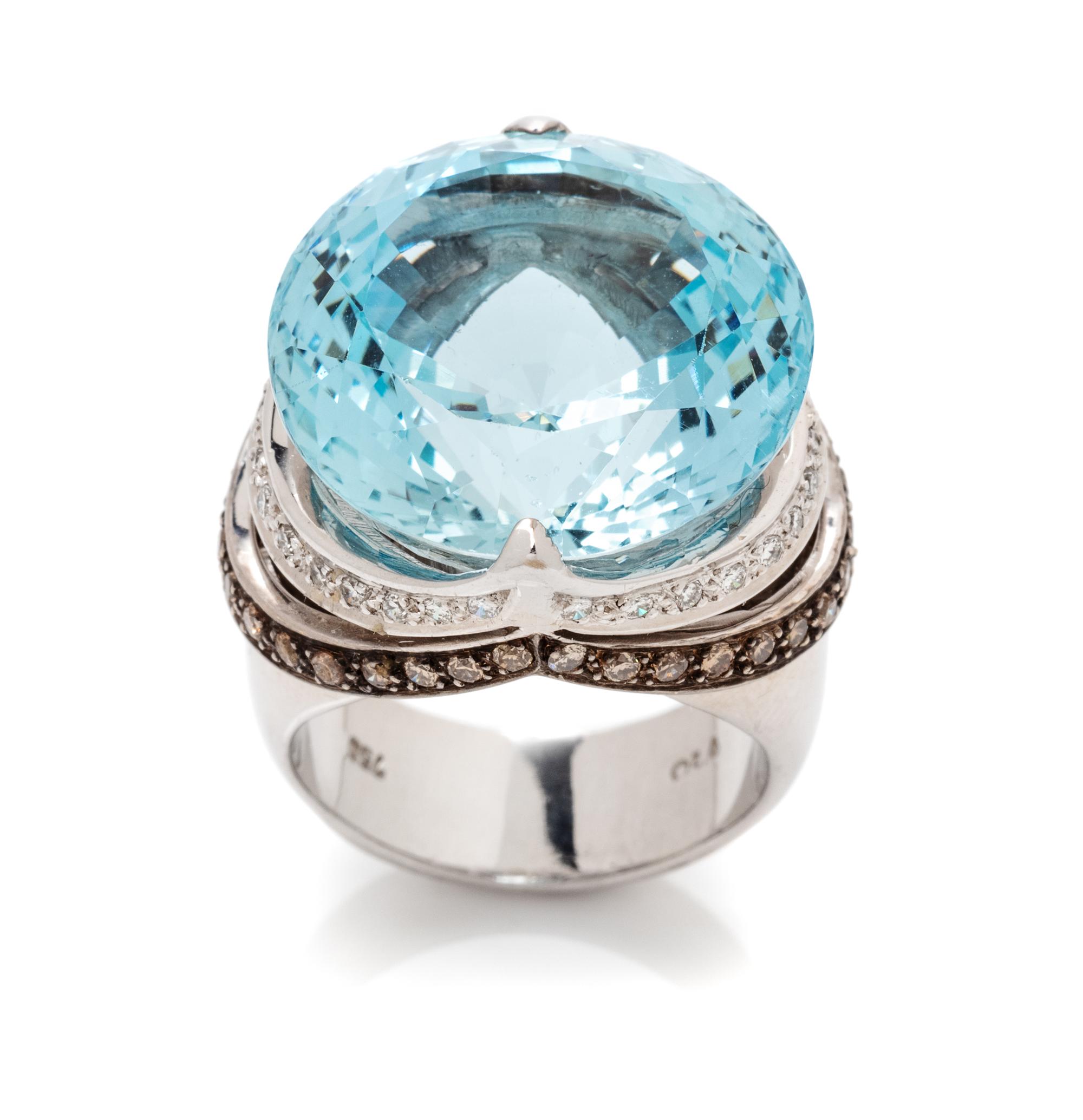 An 18 Karat White Gold, Aquamarine, Diamond and Colored Diamond Ring, 17.23 dwts.