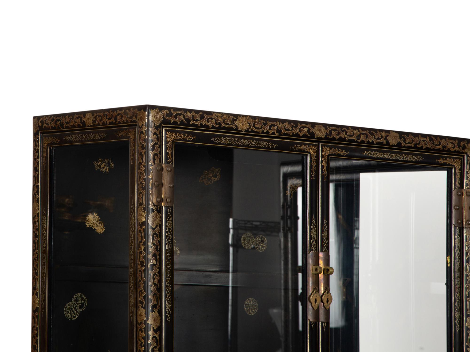 A Pair of Chinese Gilt Decorated Black Lacquer Vitrine Cabinets