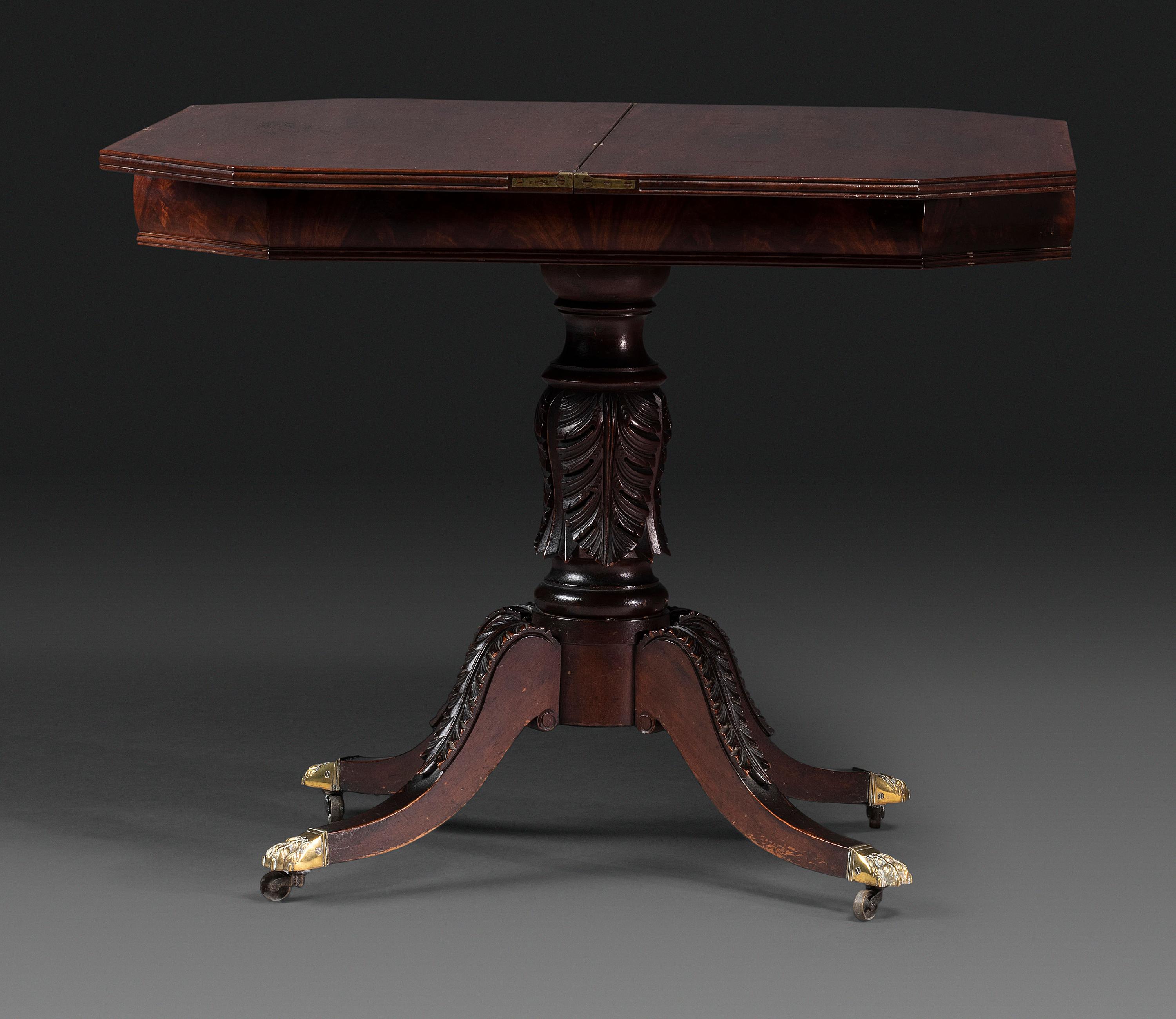 A Classical Carved and Brass Mounted Mahogany Claw-Foot Card Table