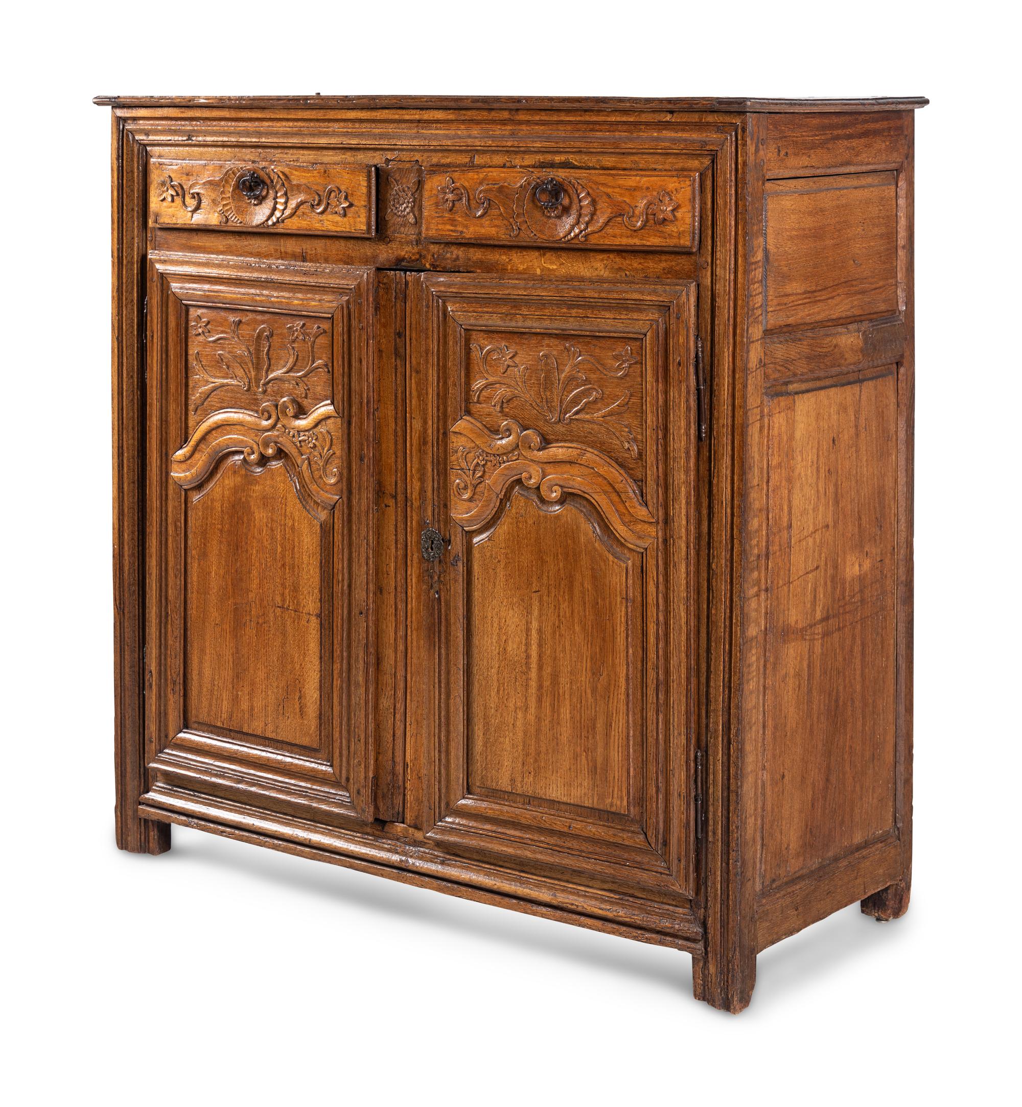 A French Provincial Carved Oak Cabinet