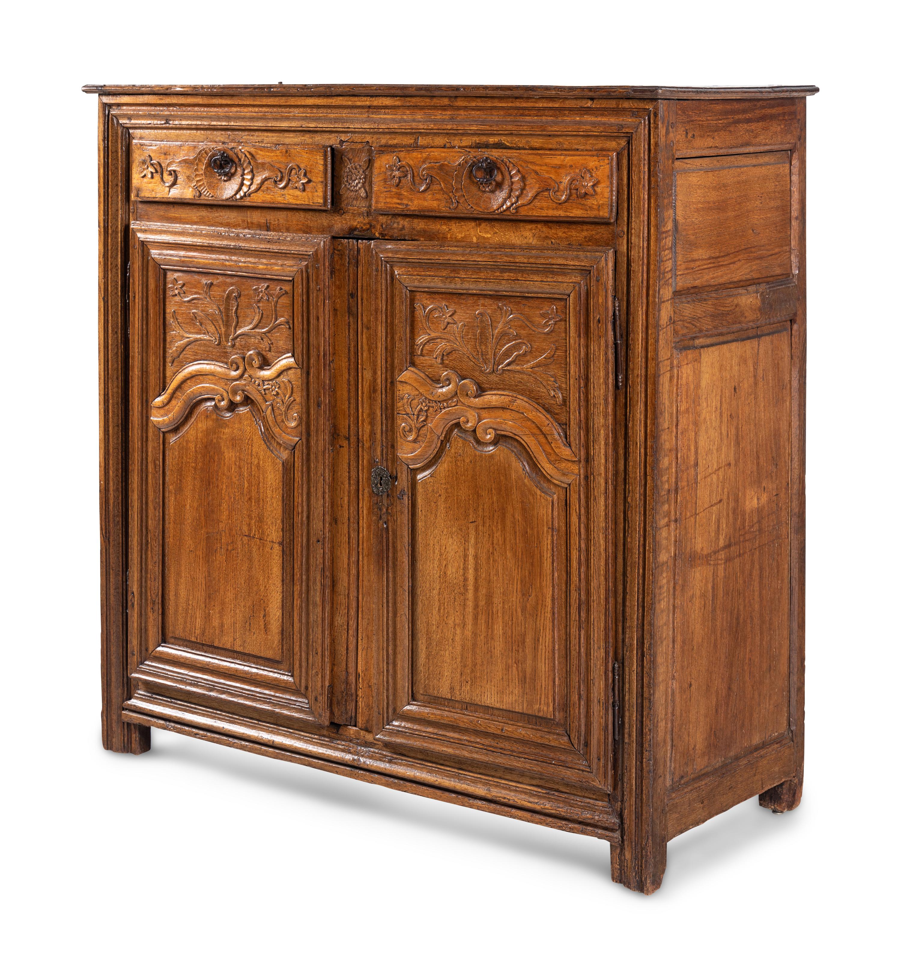 A French Provincial Carved Oak Cabinet