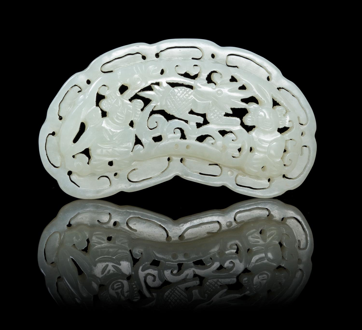 A Carved Pale Celadon Jade Plaque Length 2 3/4 inches.