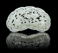 A Carved Pale Celadon Jade Plaque Length 2 3/4 inches.