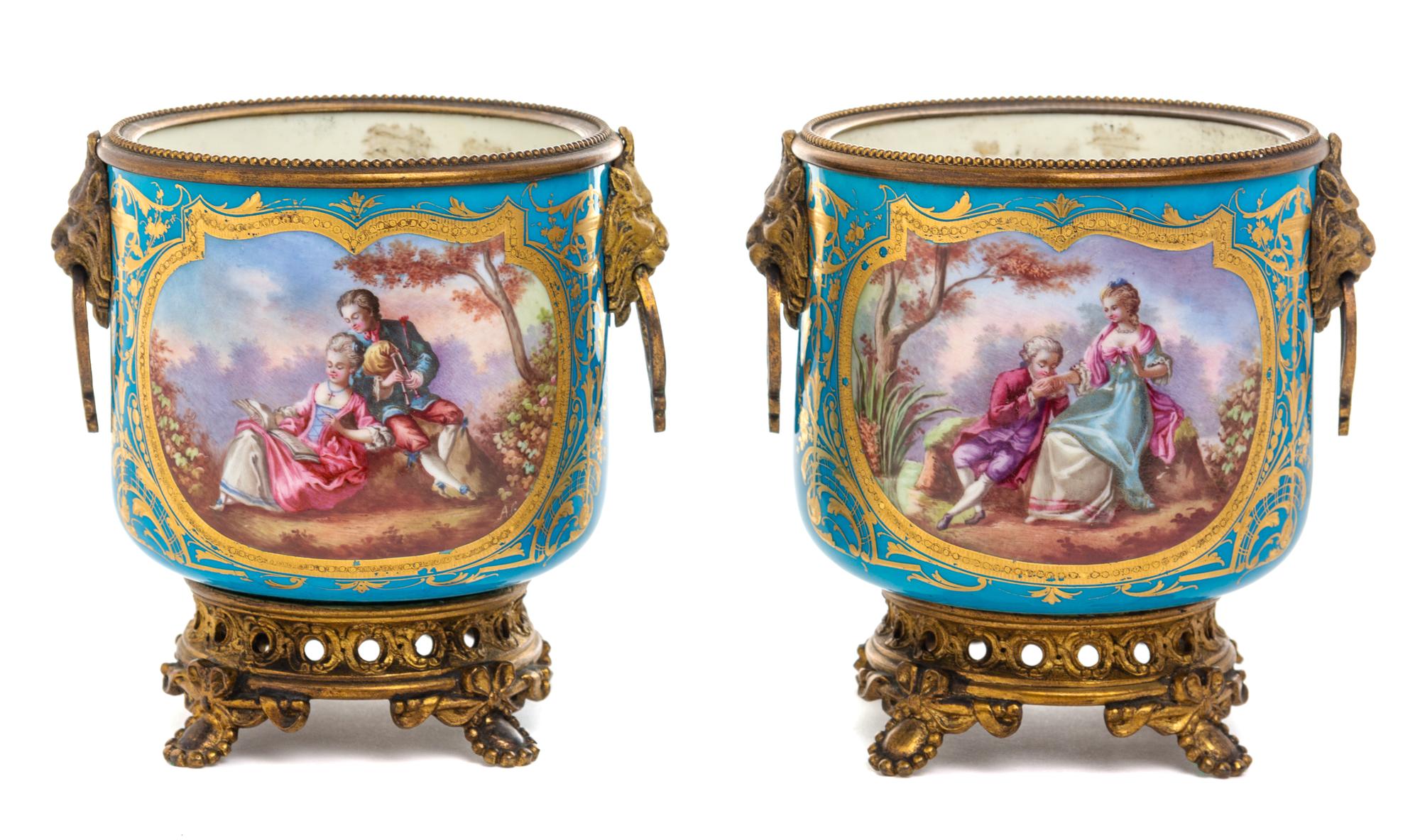 A Pair of Sevres Style Gilt Metal Mounted Porcelain Cache Pots Height 5 1/2 inches. — 19TH CENTURY