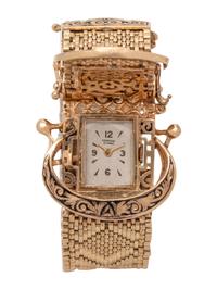 YELLOW GOLD AND ENAMEL BELT MOTIF SURPRISE WRISTWATCH